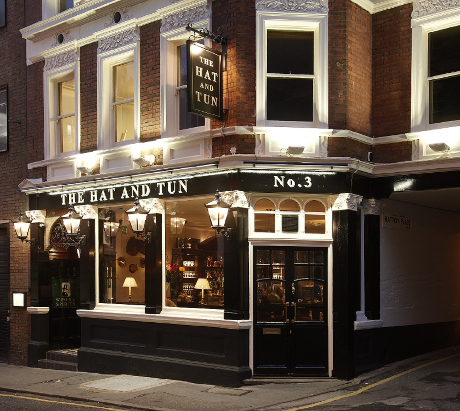 Charming venue The Hat & Tun with warm lighting, ideal for intimate events and meetings.