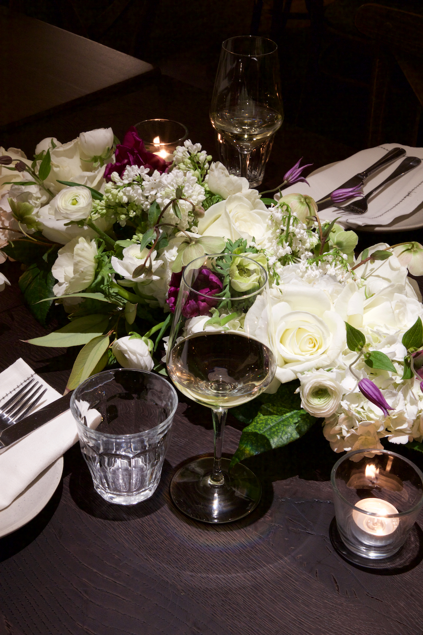 Elegant table with floral centerpiece at Brasserie Blanc Southbank for upscale events.