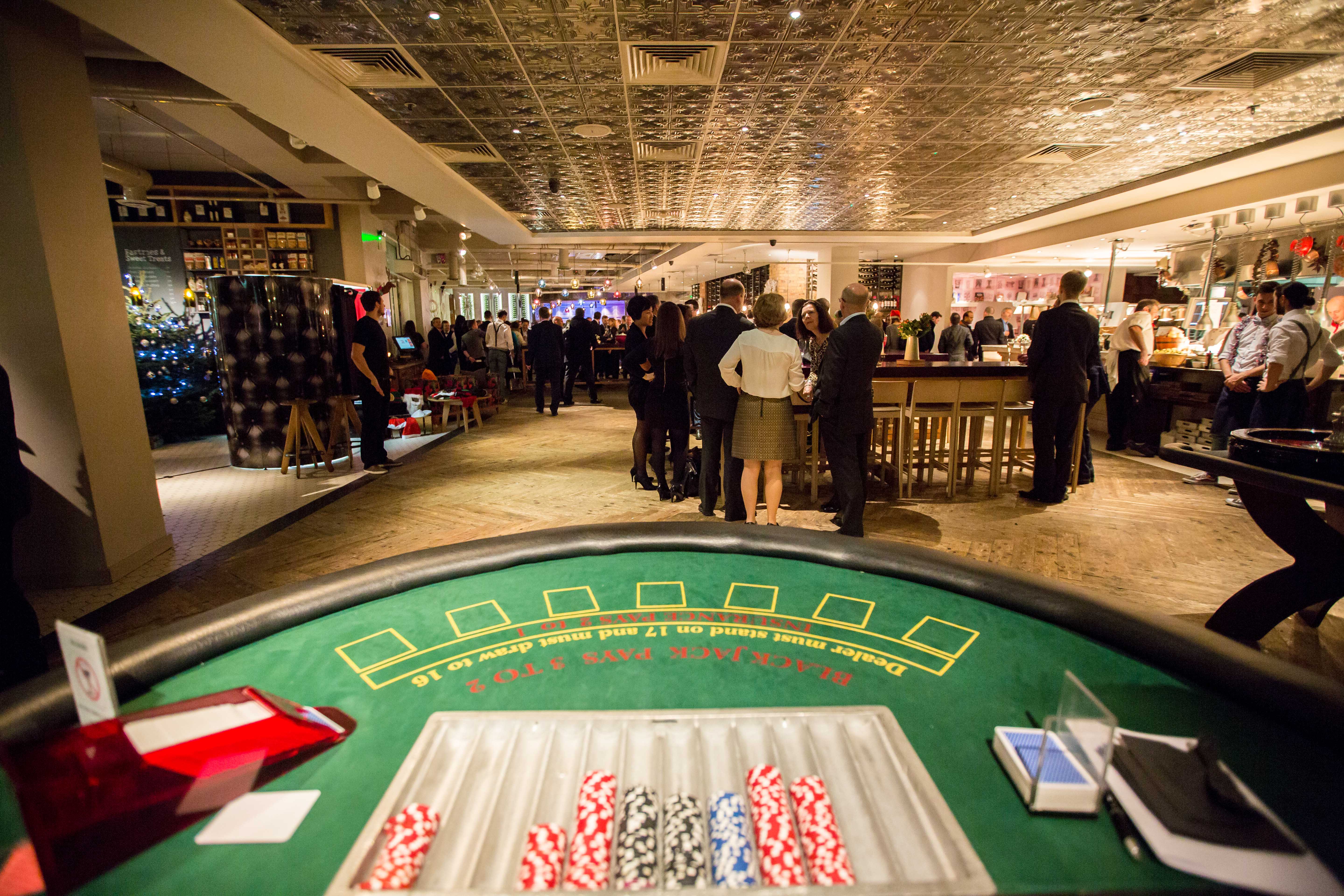Private room at The Anthologist for a lively casino-themed event with poker table.