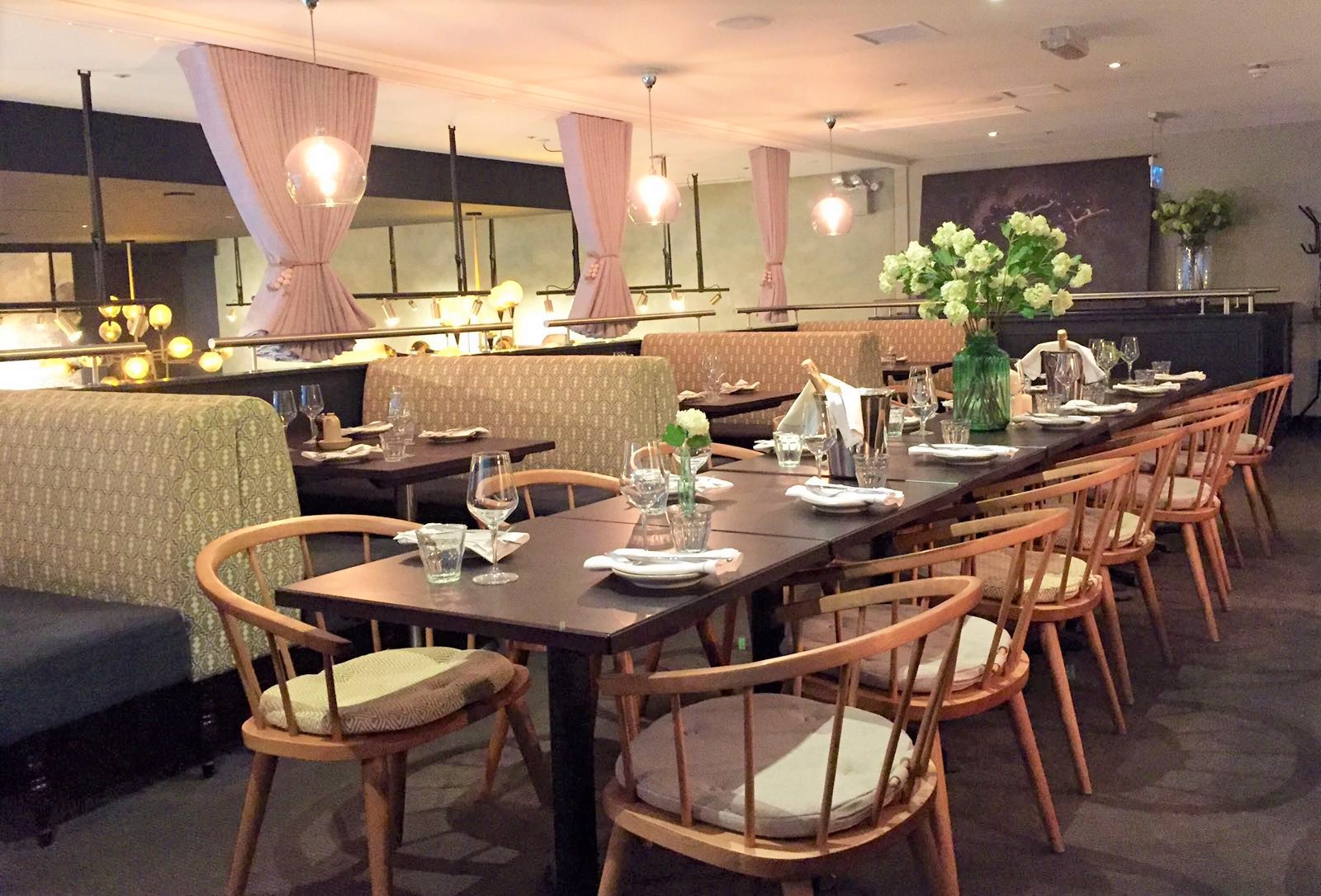 Semi-private Mezzanine at Brasserie Blanc, elegant dining for corporate events and gatherings.