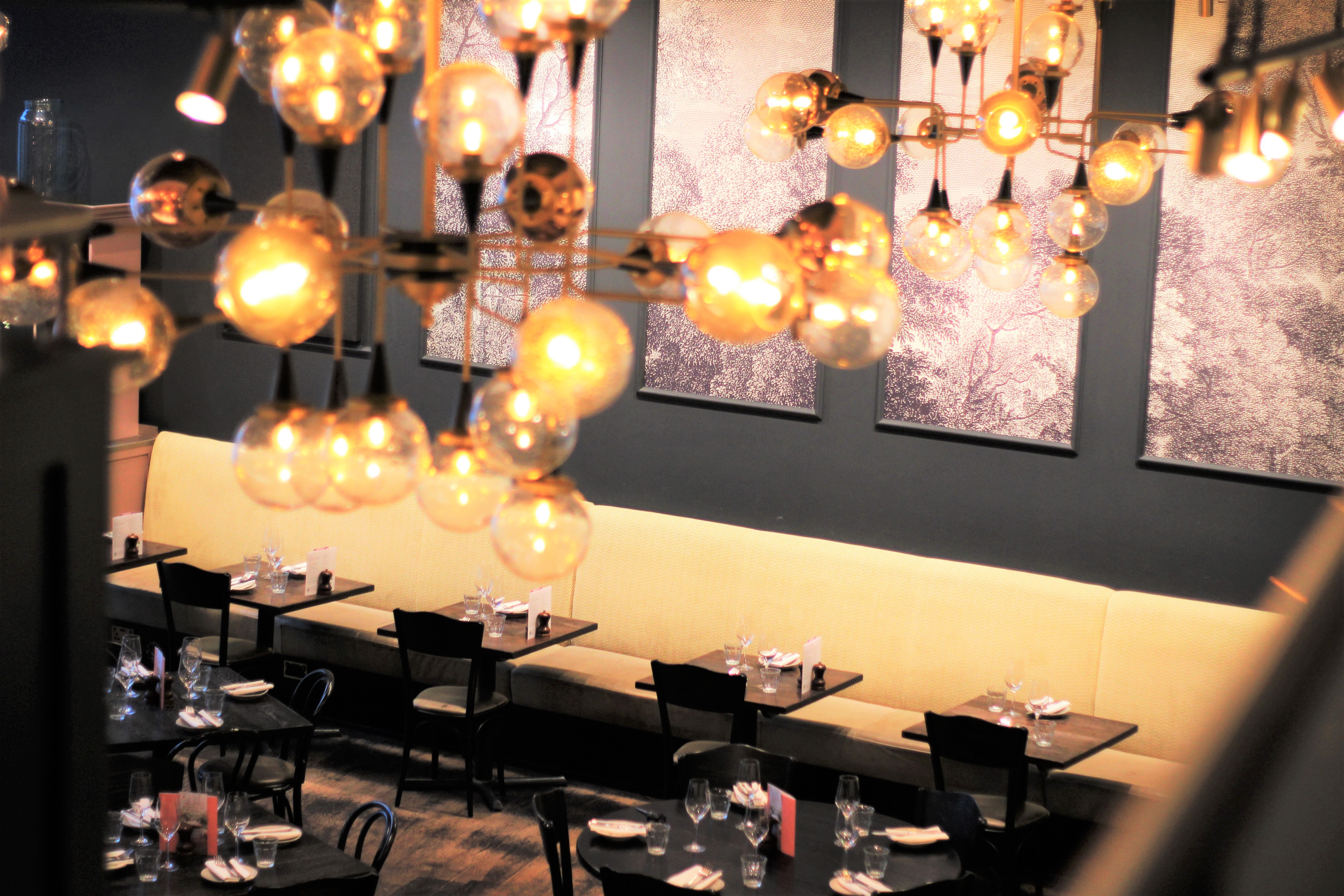 Semi-private Mezzanine at Brasserie Blanc, elegant dining for corporate events and gatherings.