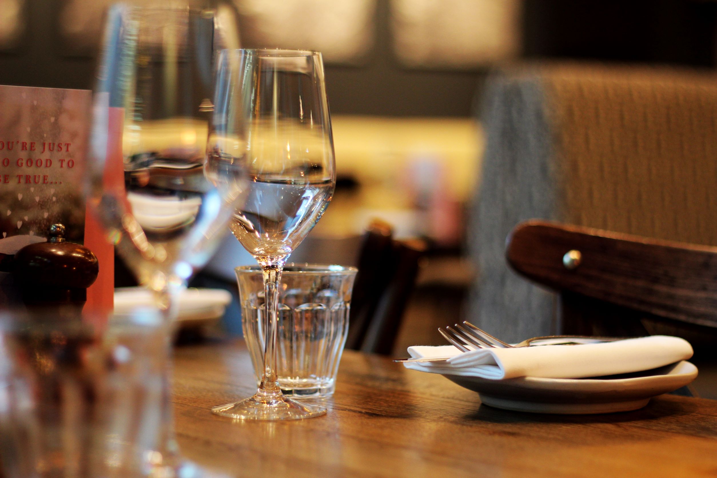 Semi-private dining table in Brasserie Blanc, ideal for intimate meetings and events.