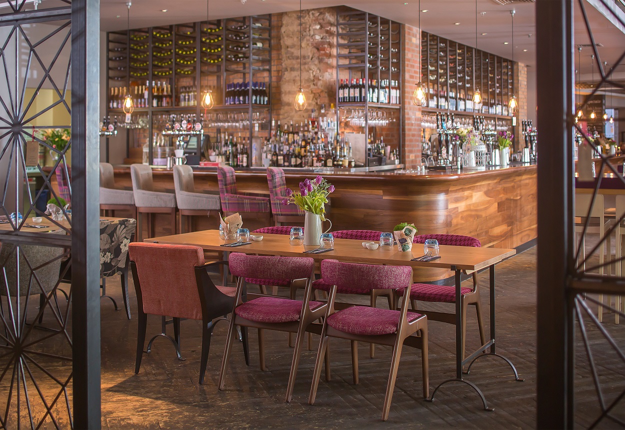 Stylish bar area in The Snug, perfect for networking events and intimate meetings.