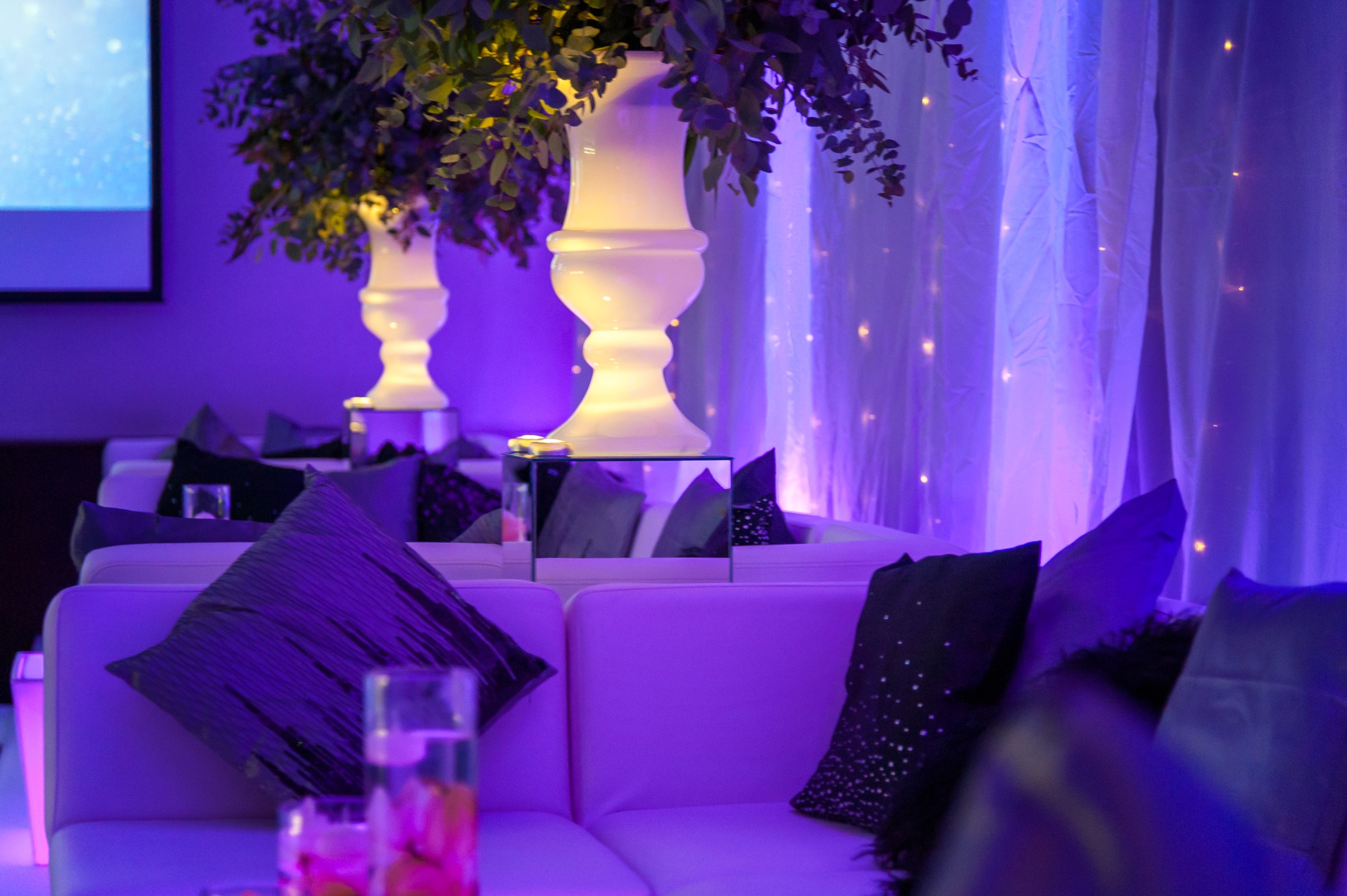 Tower Suite at Hilton London Tower Bridge, elegant seating and floral decor for upscale events.