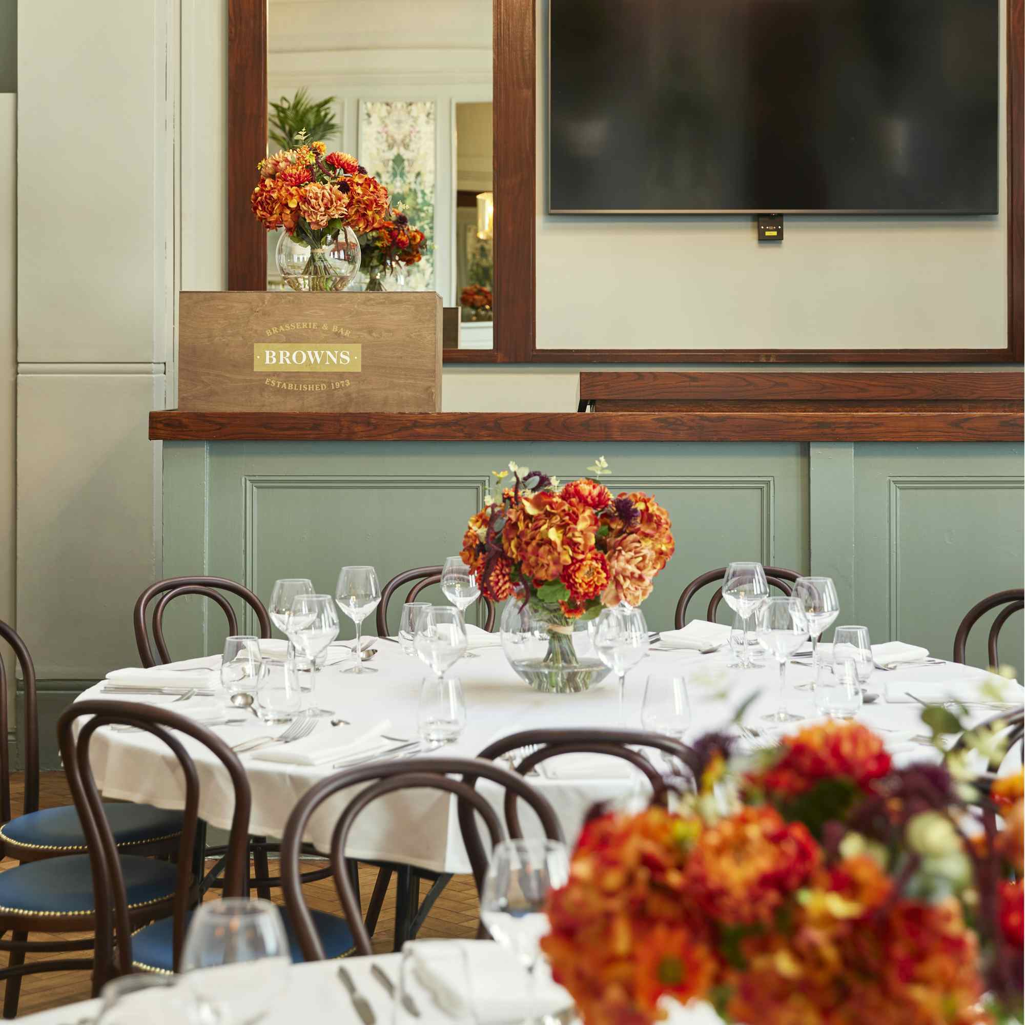 Elegant dining table with floral centerpiece at Barrister Court, ideal for events and gatherings.