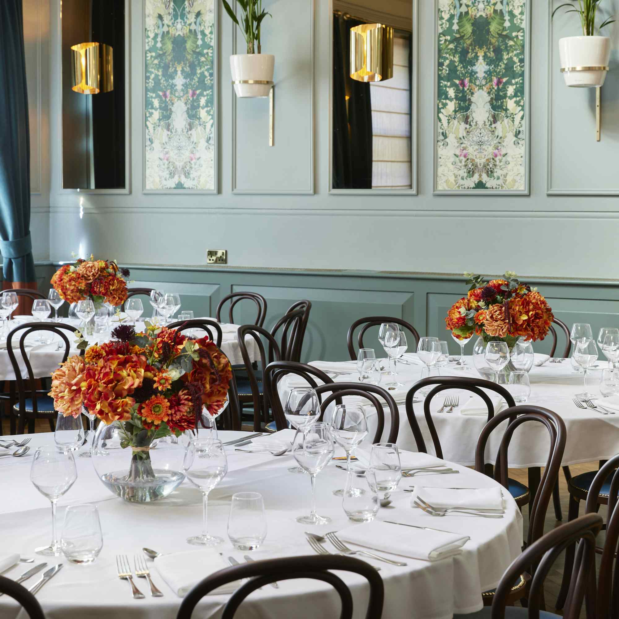 Elegant dining space at Barrister Court, featuring floral centerpieces for formal events.