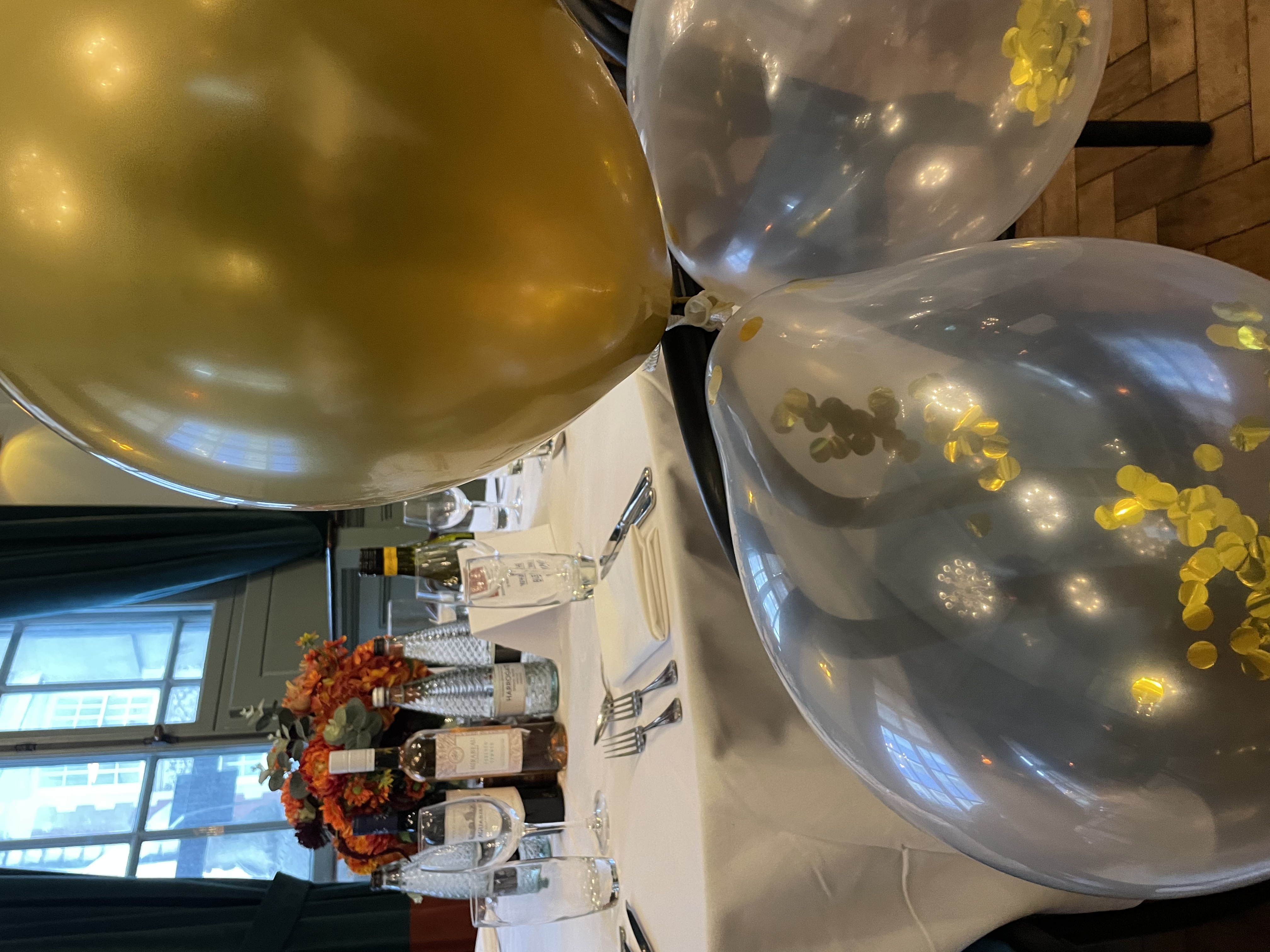 Elegant event table in Judge's Chambers, Browns Covent Garden with festive balloons.