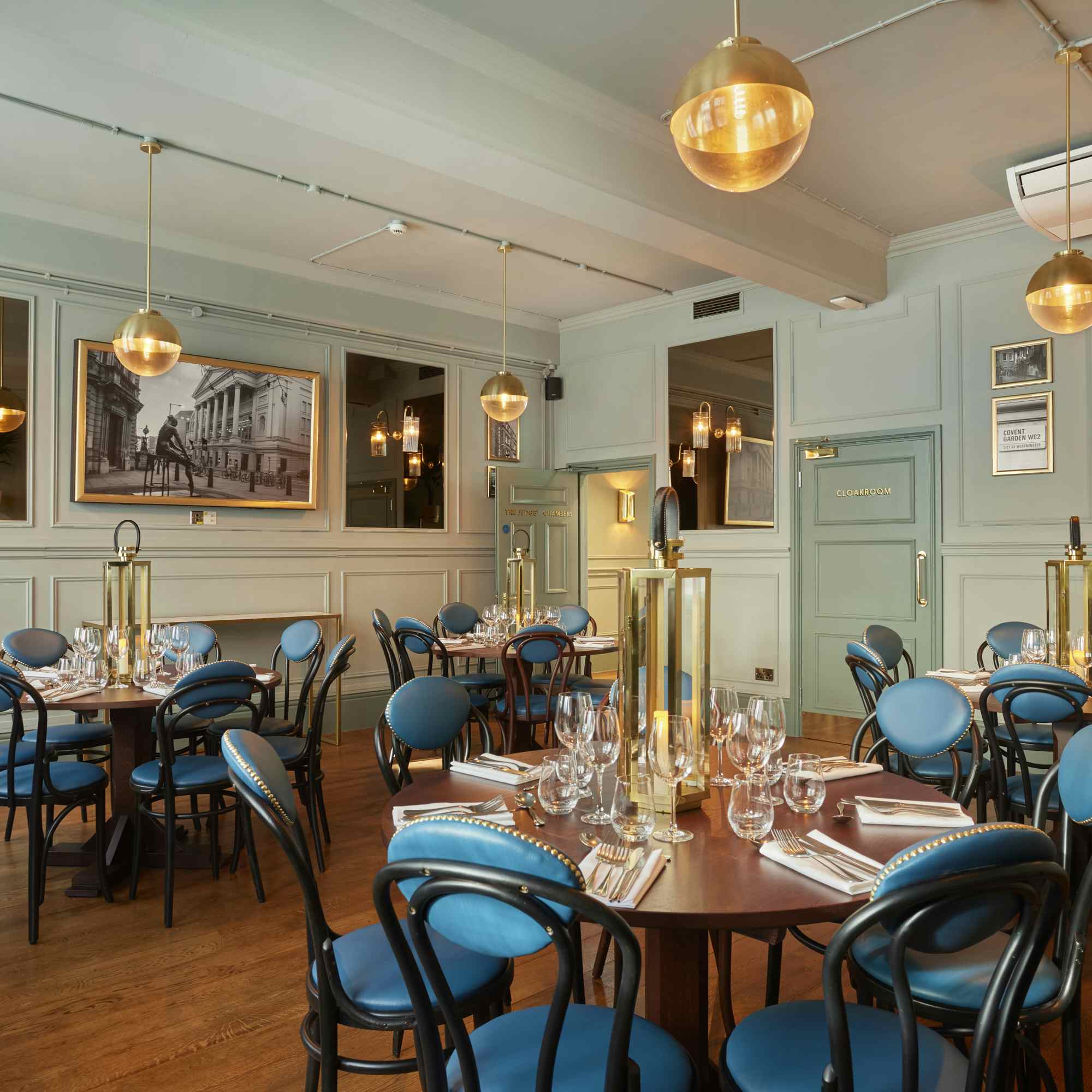 Judge's Chambers dining space with blue chairs, perfect for corporate events and gatherings.