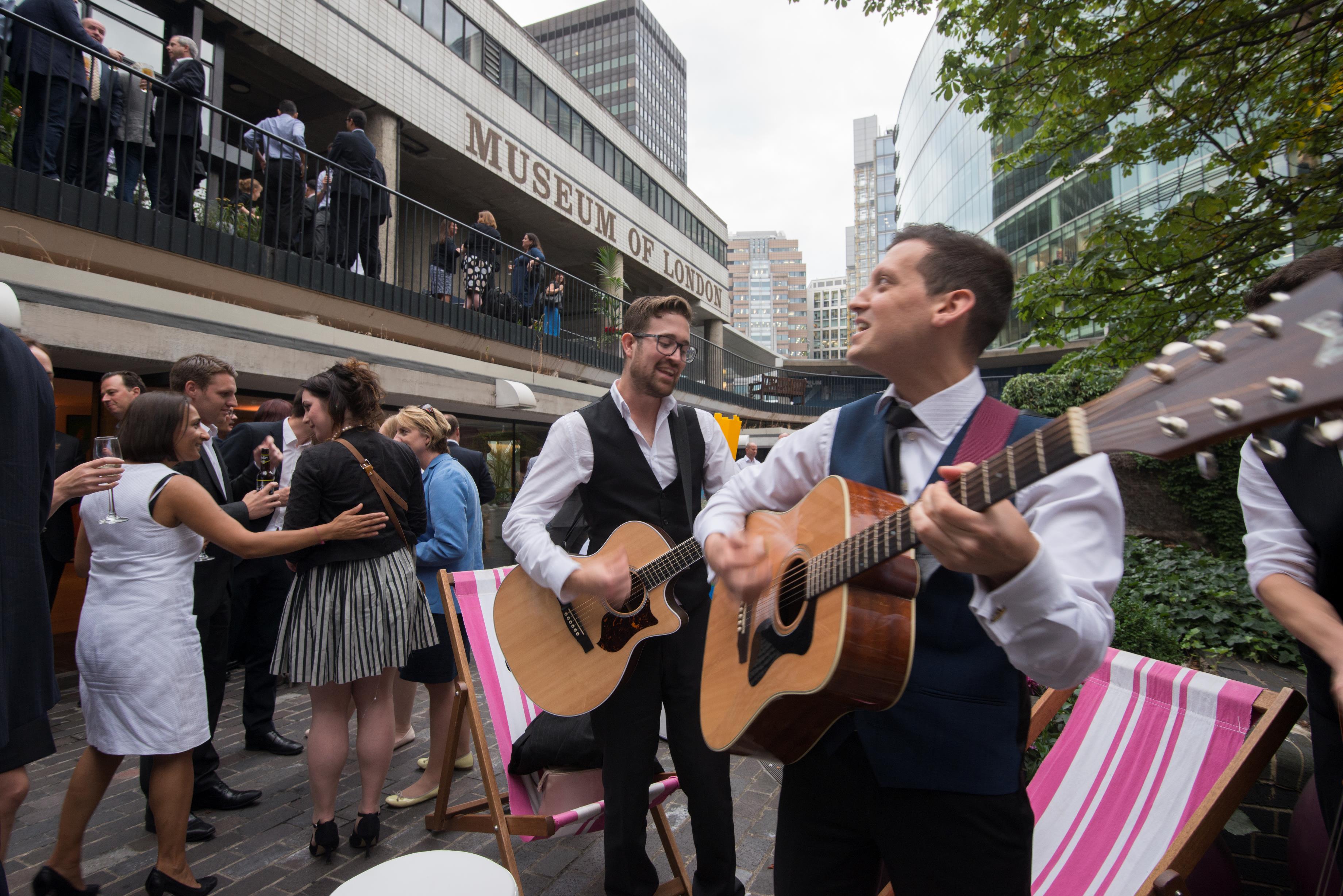 Outdoor acoustic music event at Terrace Gallery, London; vibrant atmosphere and networking.