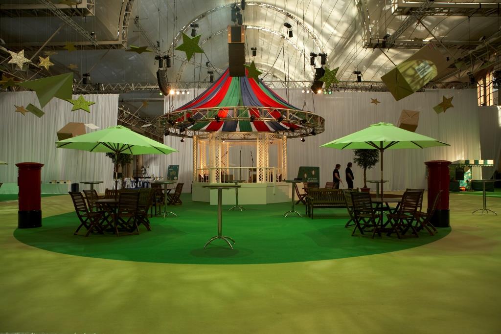 Great Hall at Alexandra Palace with colorful carousel, ideal for festive gatherings.