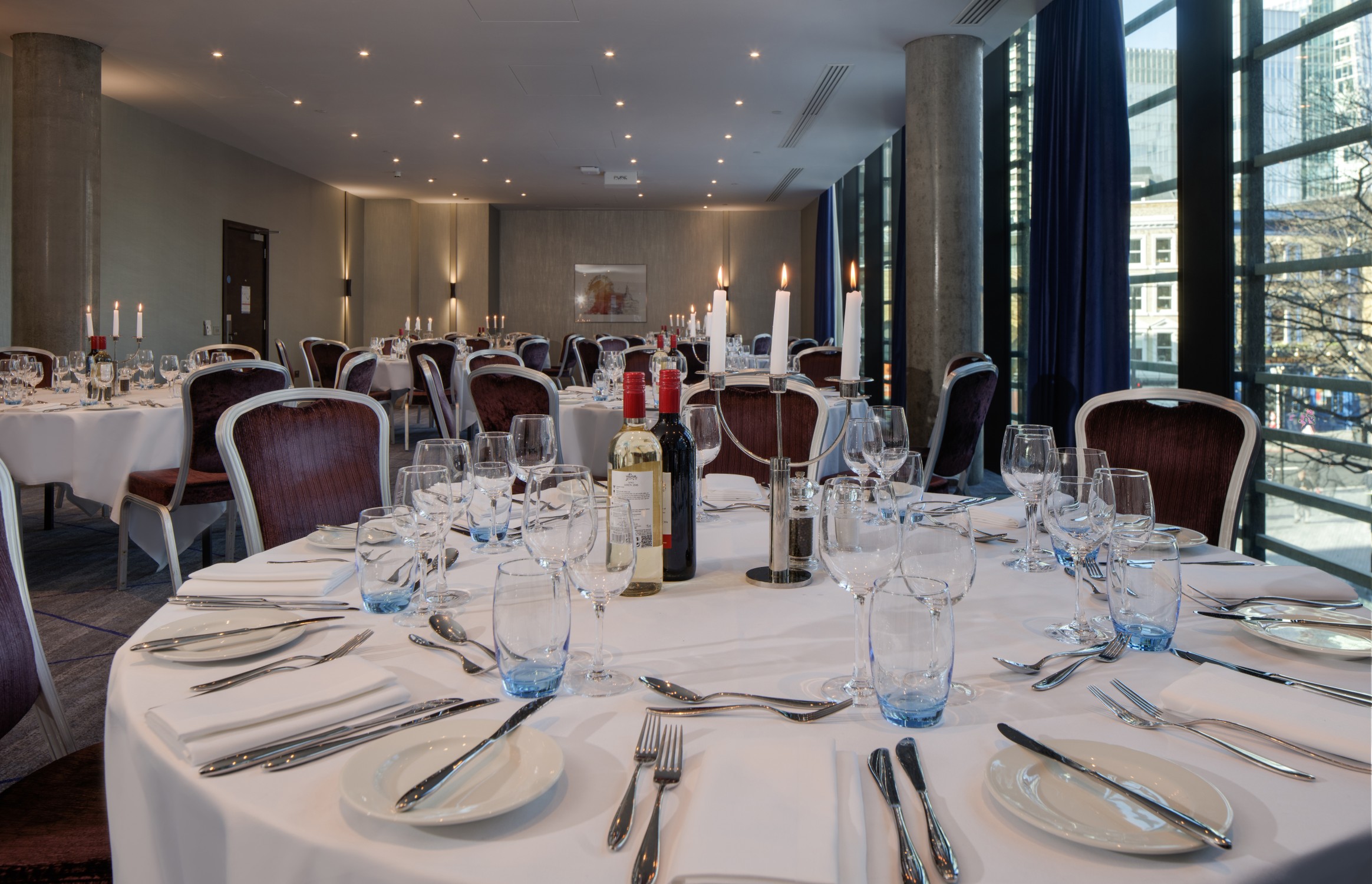 Elegant dining table setup in Hilton London Tower Bridge for corporate events and gatherings.