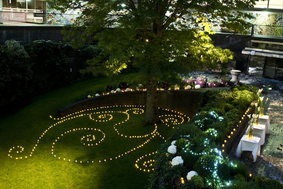 Terrace Gallery outdoor event space with candles, ideal for weddings and gatherings.