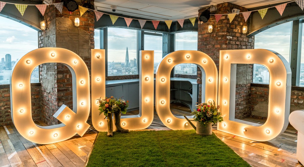Vibrant Altitude London venue with oversized "QUAD" letters, perfect for celebrations.