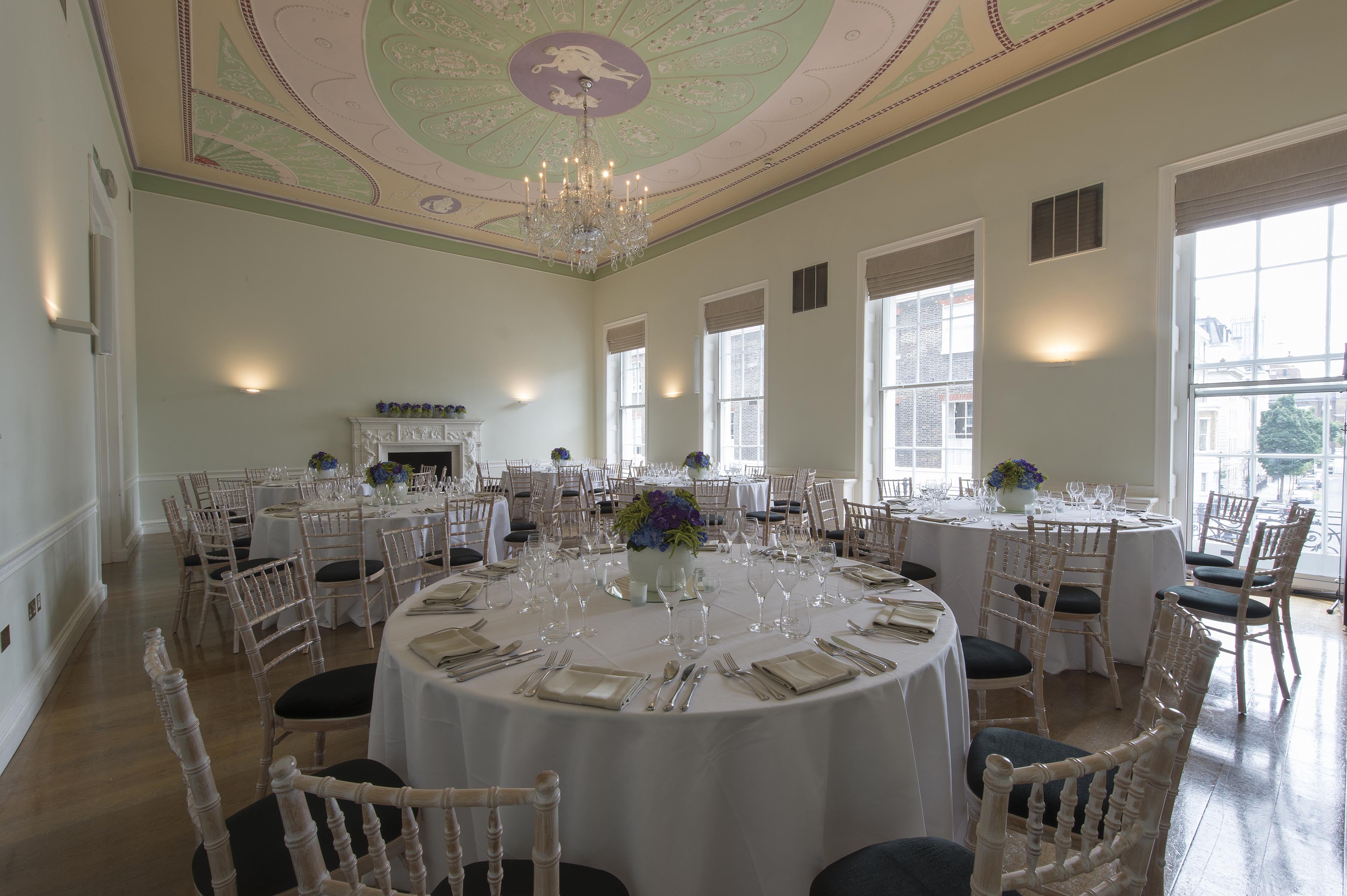 Elegant event space in Asia House with fine dining setup for upscale meetings and receptions.