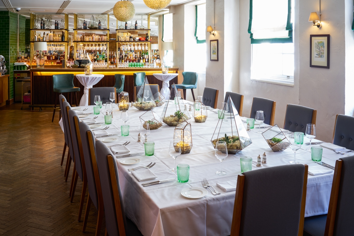 Elegant dining setup in The Sir Roger Moore Room, ideal for corporate meetings and events.