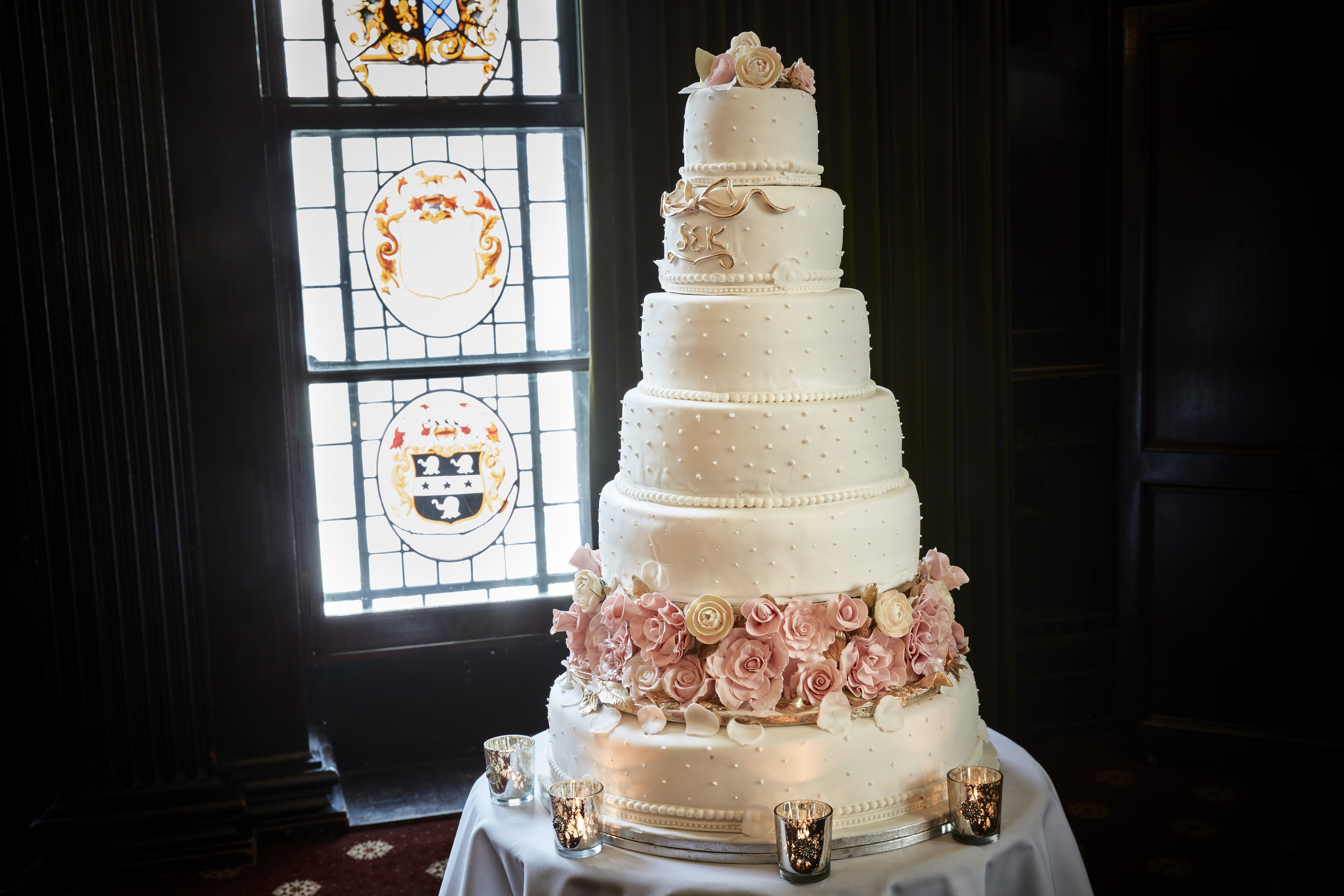 Elegant multi-tiered wedding cake with floral accents at The Common Room, 113 Chancery Lane.