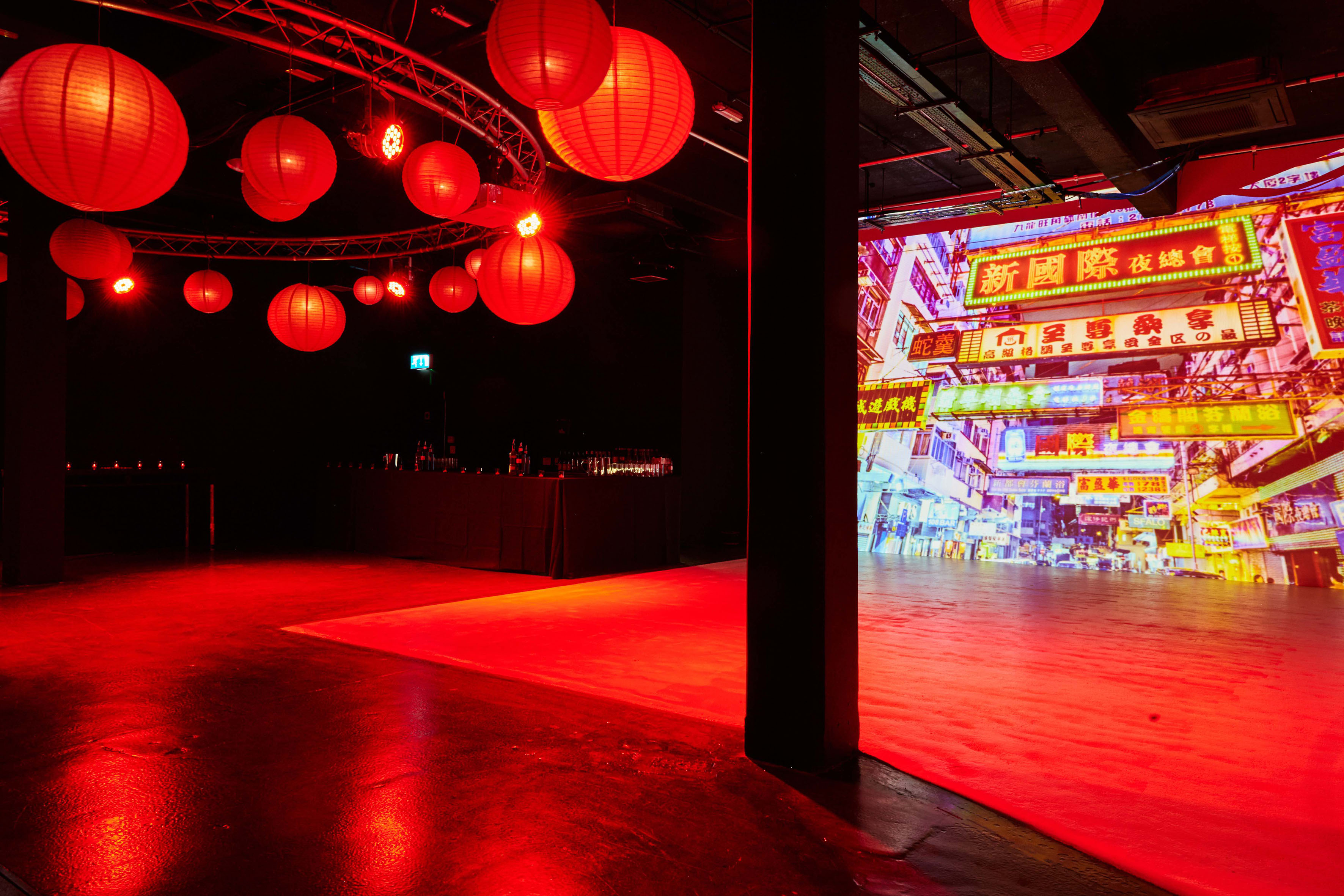 Vibrant event space with red lanterns, ideal for themed celebrations and networking.