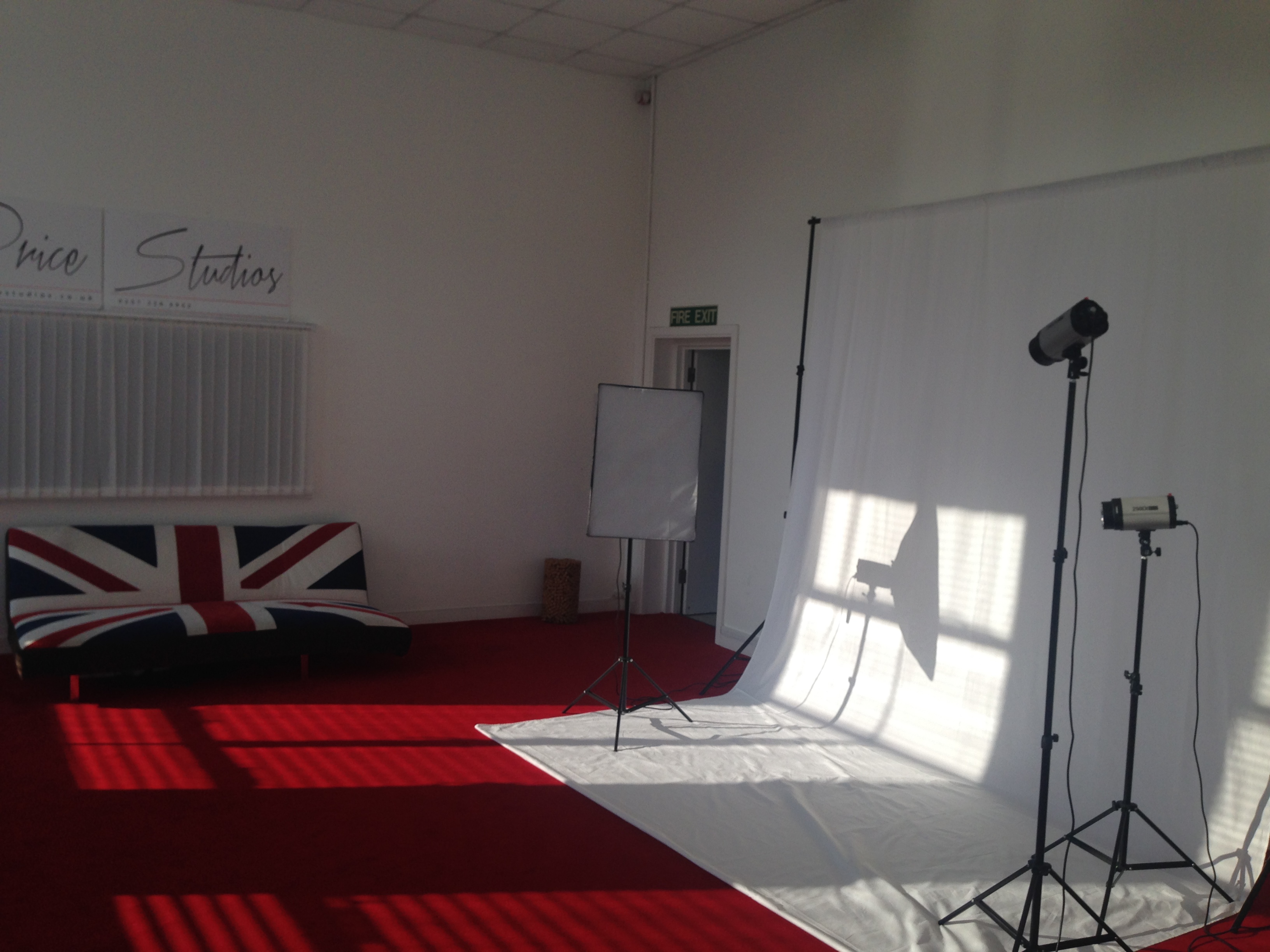 Versatile event space with Union Jack sofa, ideal for photo shoots and workshops.