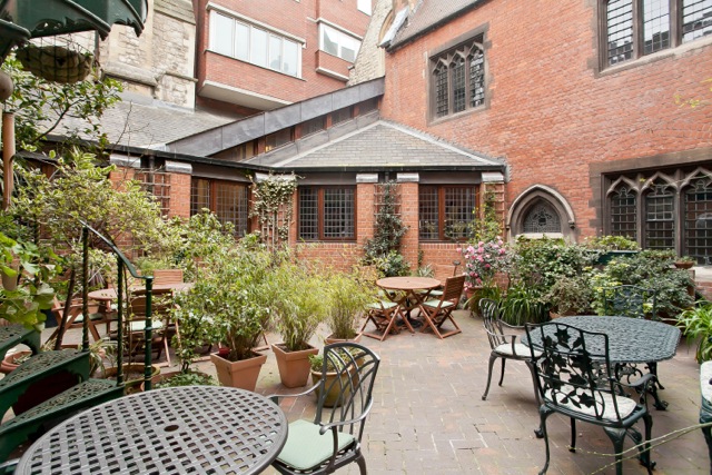 Trevelyan Hall courtyard with rustic tables, ideal for networking events and conferences.