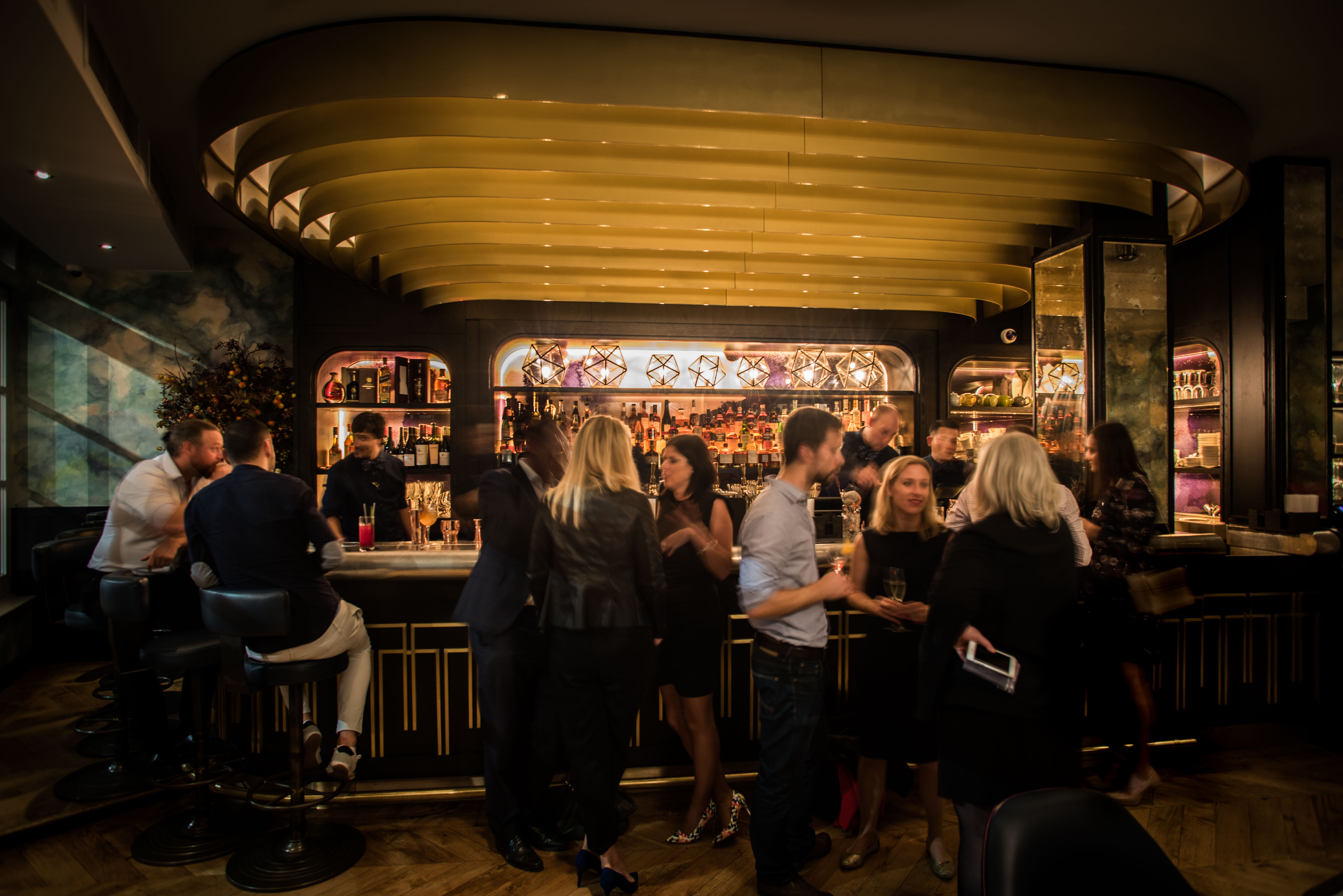 Vibrant bar scene at The Botanist, ideal for networking events and cocktail receptions.