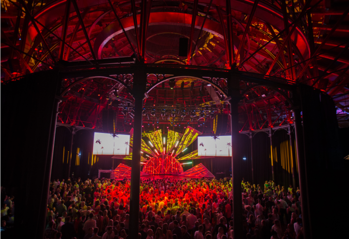 Vibrant event space in Roundhouse with dynamic lighting for concerts and gatherings.