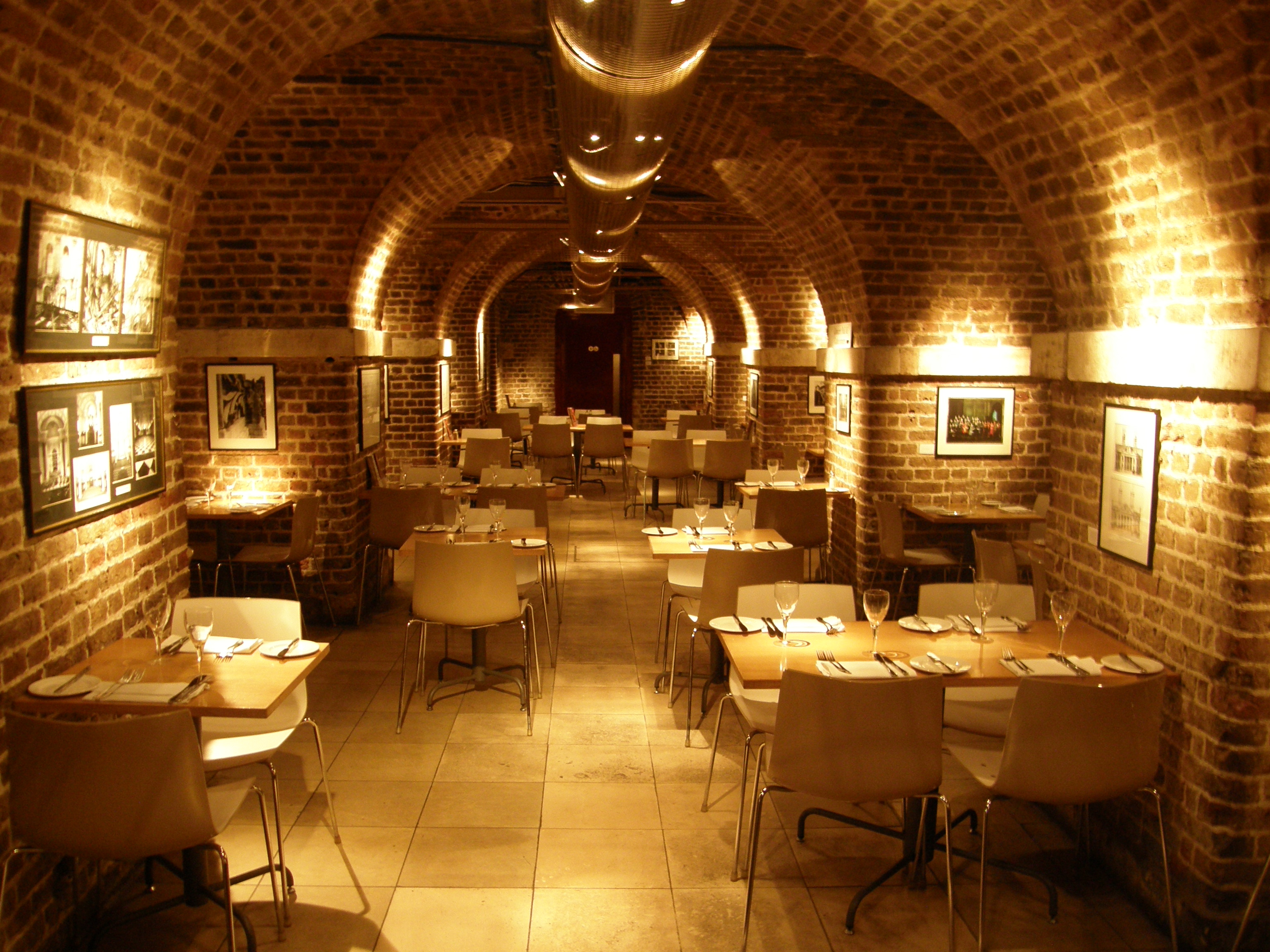 Stylish brick-arched dining space in The Crypt, ideal for corporate events and intimate gatherings.