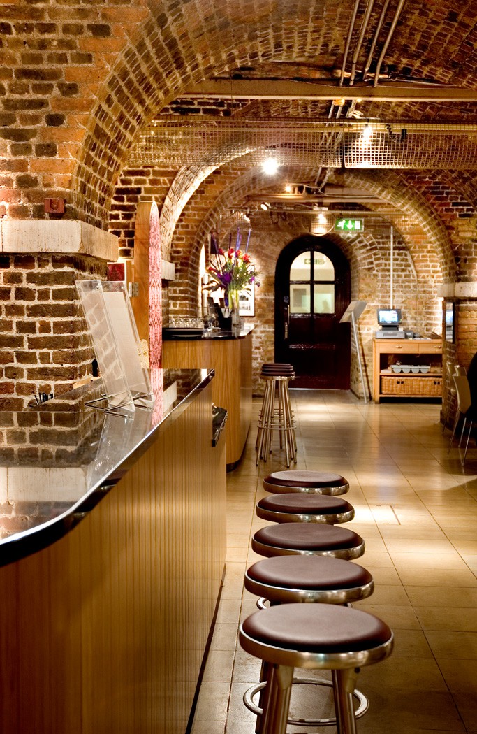 Stylish venue with exposed brick walls for intimate meetings and events in Smith Square.