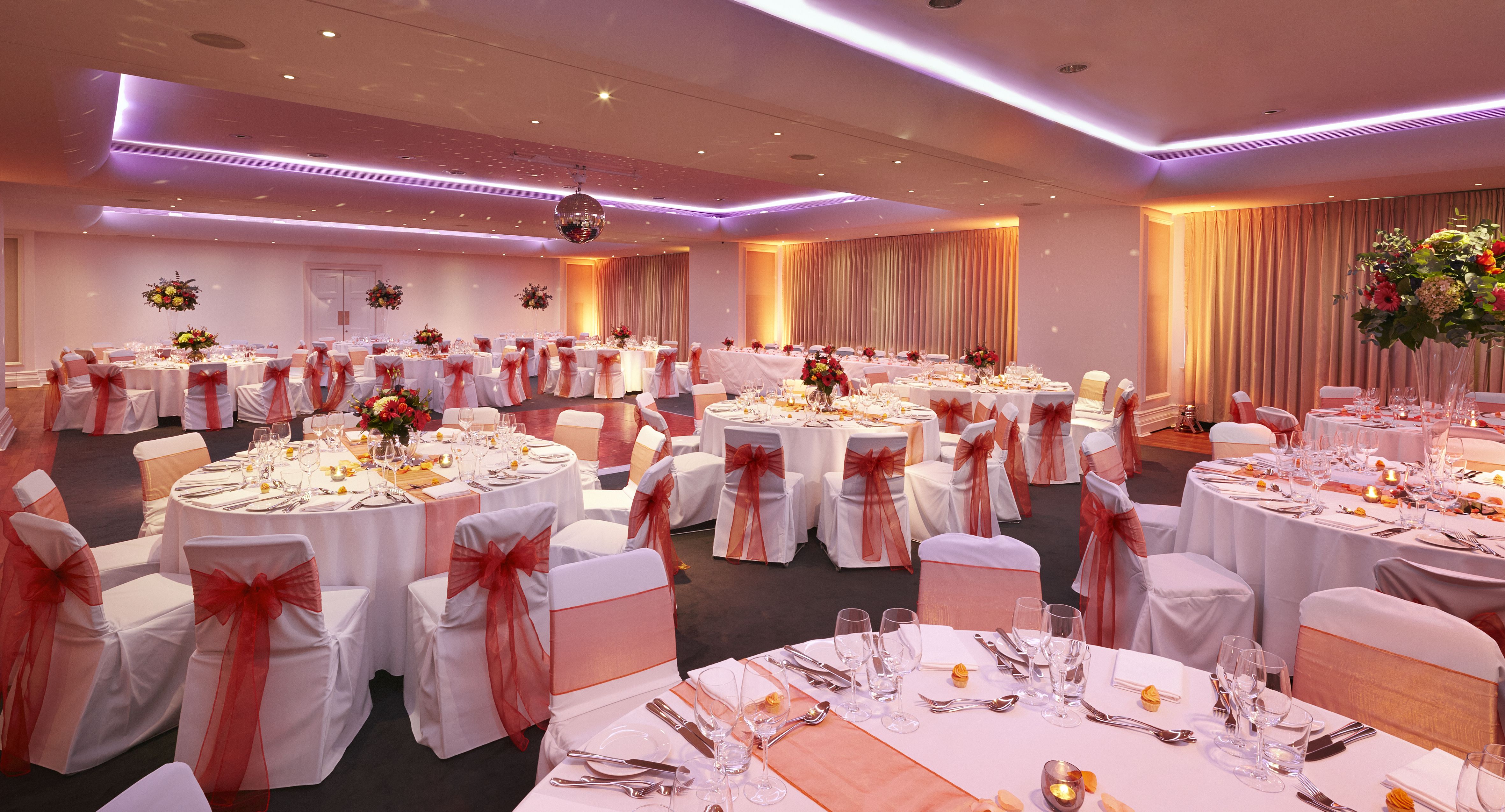 Great Eastern Suite at Andaz London: elegant wedding venue with floral centerpieces.