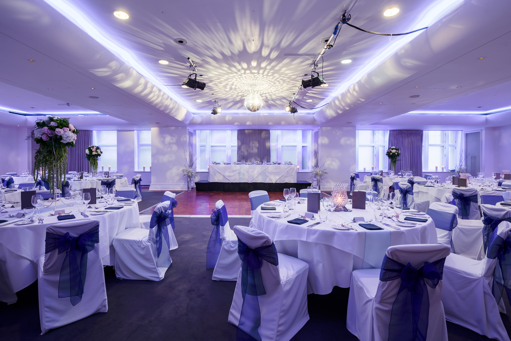 Great Eastern Suite at Andaz London, elegant wedding venue with blue accents and floral decor.