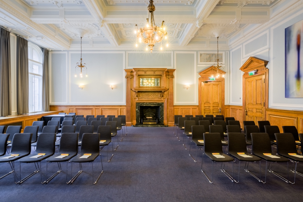 Elegant meeting room at Andaz London, featuring wood paneling and natural light.