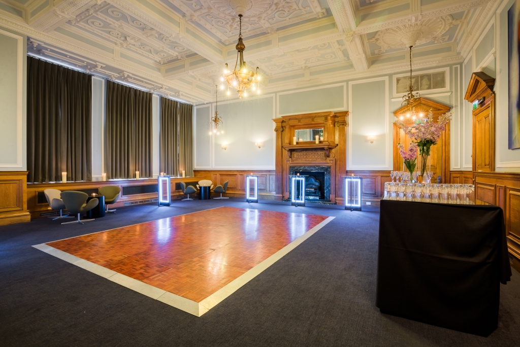 Elegant event space at Andaz London with polished wooden dance floor and bar setup.