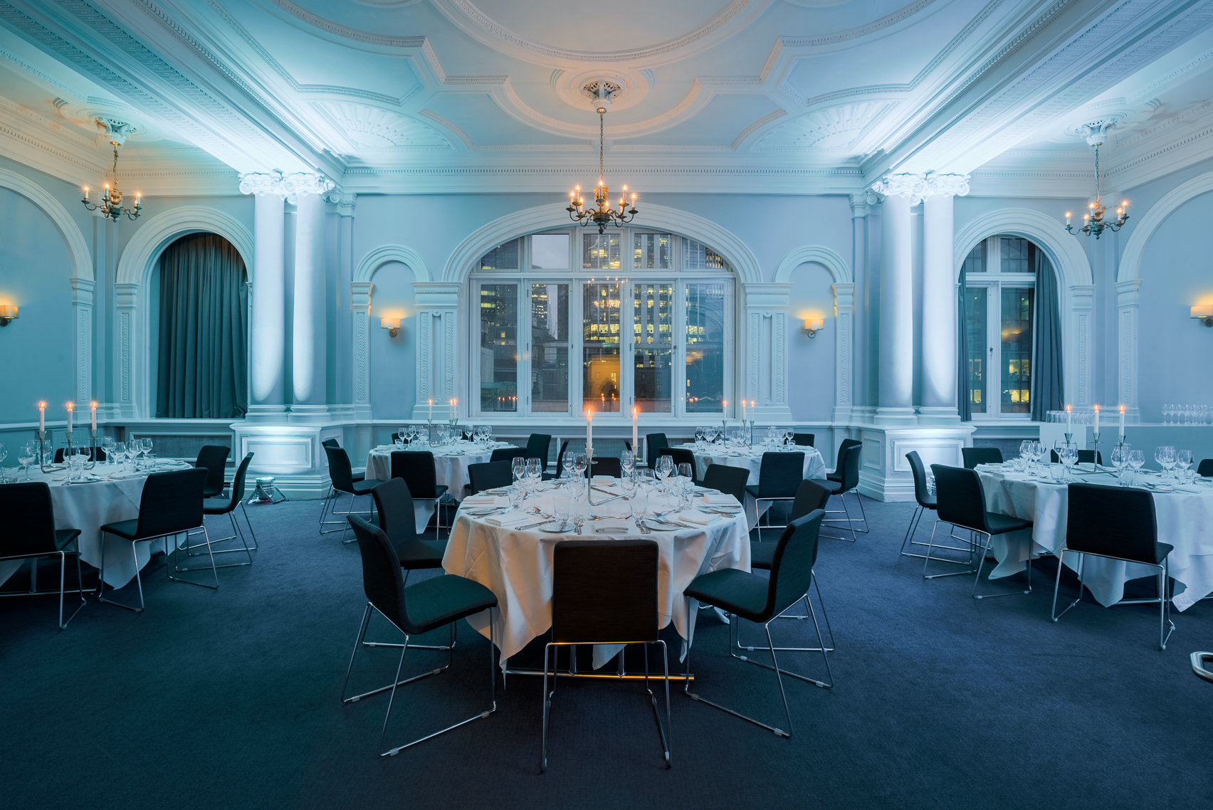 Elegant Fenchurch Suite with white linens, ideal for sophisticated dinners and galas.