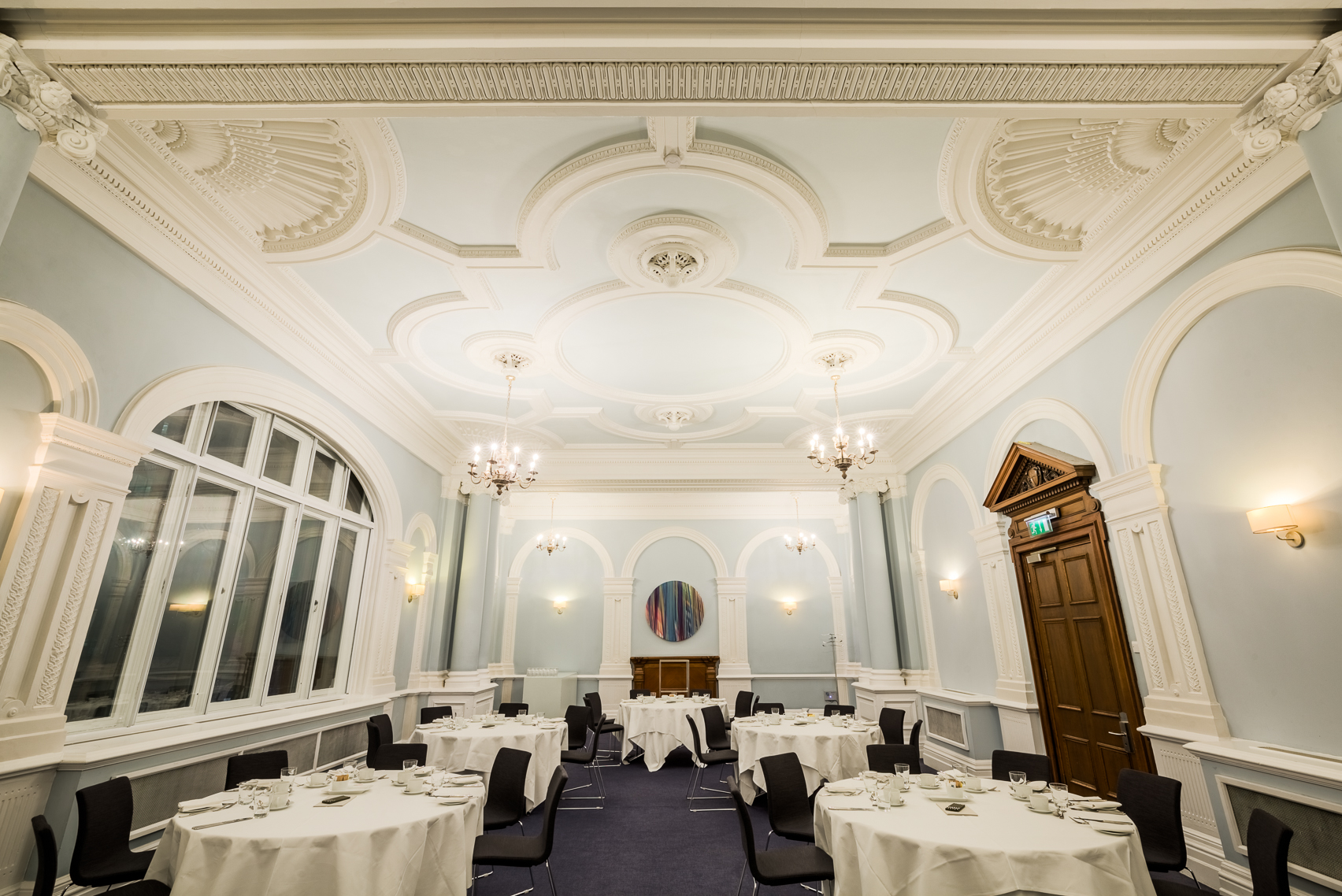 Elegant Fenchurch Suite with blue walls, ideal for upscale meetings and formal dinners.