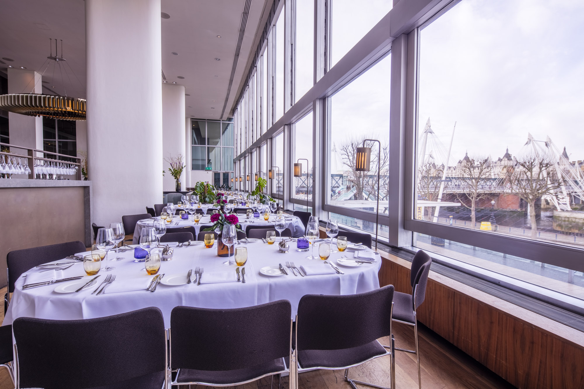 Elegant dining table with floral centerpieces at River View, perfect for upscale events.