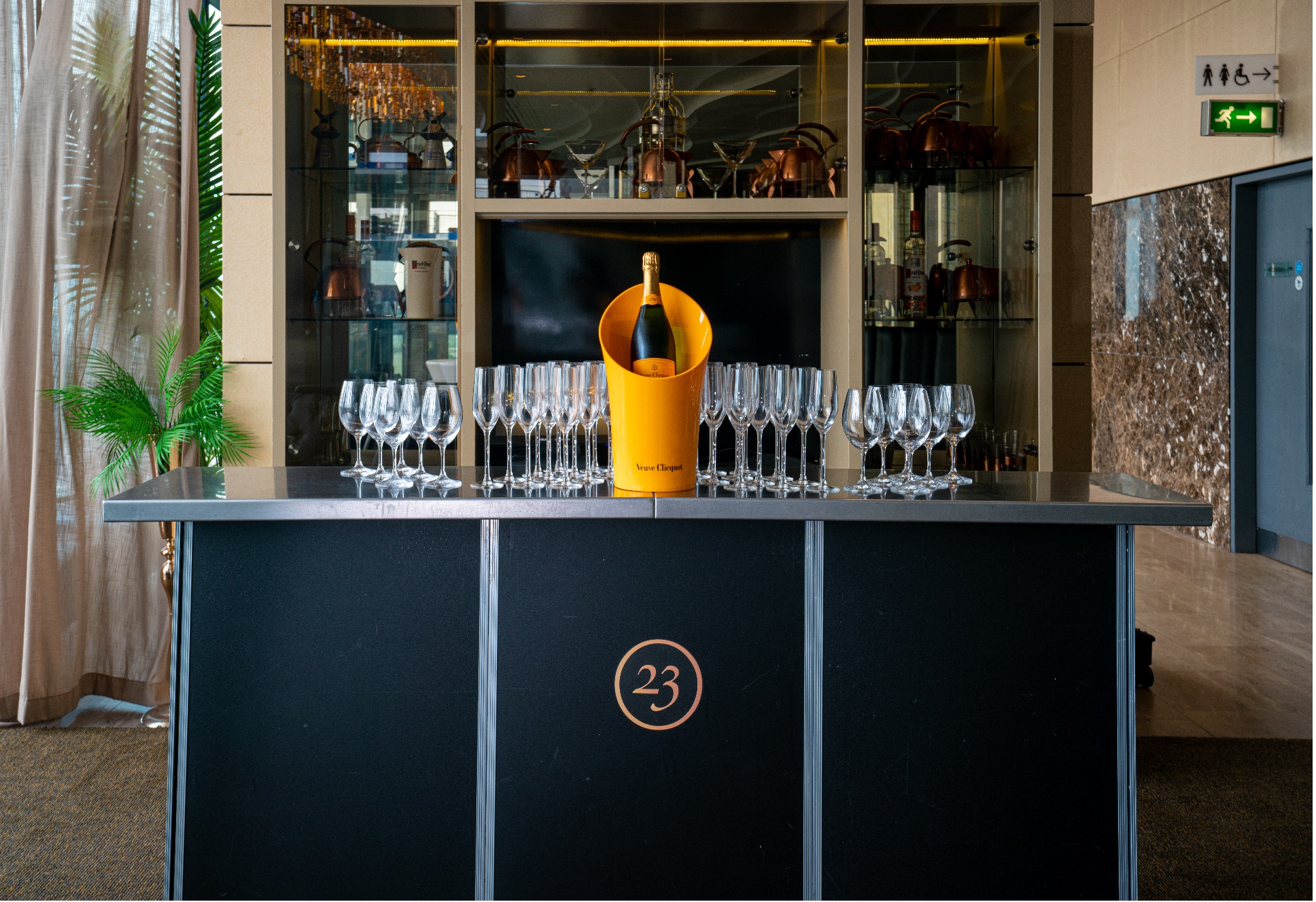 Sleek bar setup with champagne at Cloud 23, ideal for networking and celebrations.