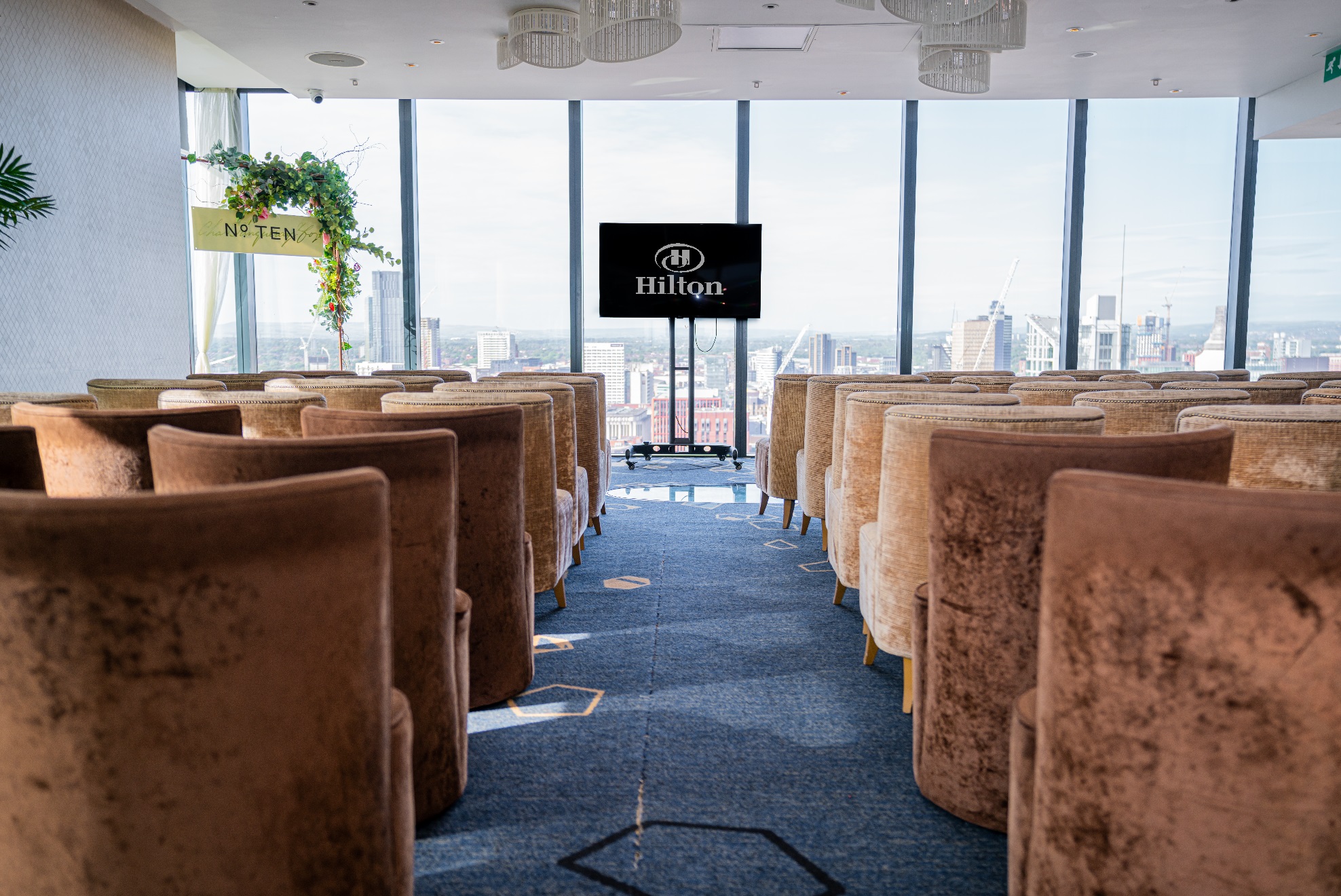 Modern event space at Cloud 23, Hilton Deansgate, with plush seating and city views.