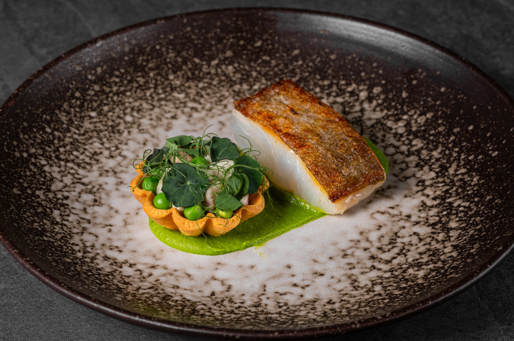 "Elegant fish dish at Podium Restaurant, perfect for upscale events and dining."