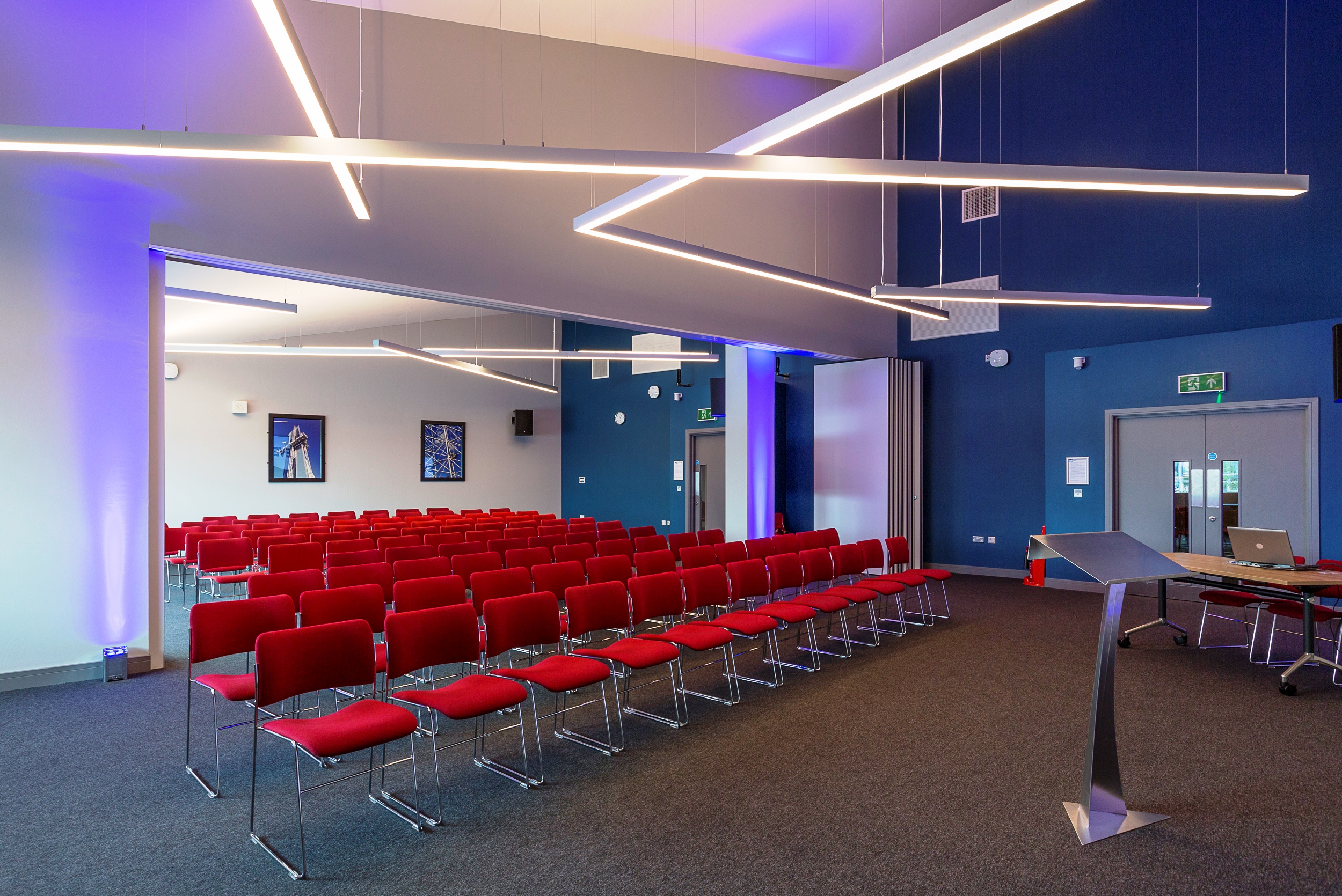WaterShard 2 event space with red chairs, ideal for conferences and workshops.