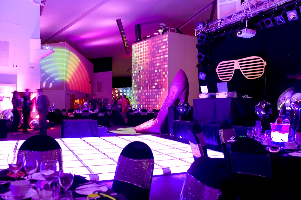 Vibrant event space at Imperial War Museum North with dynamic lighting and decor.