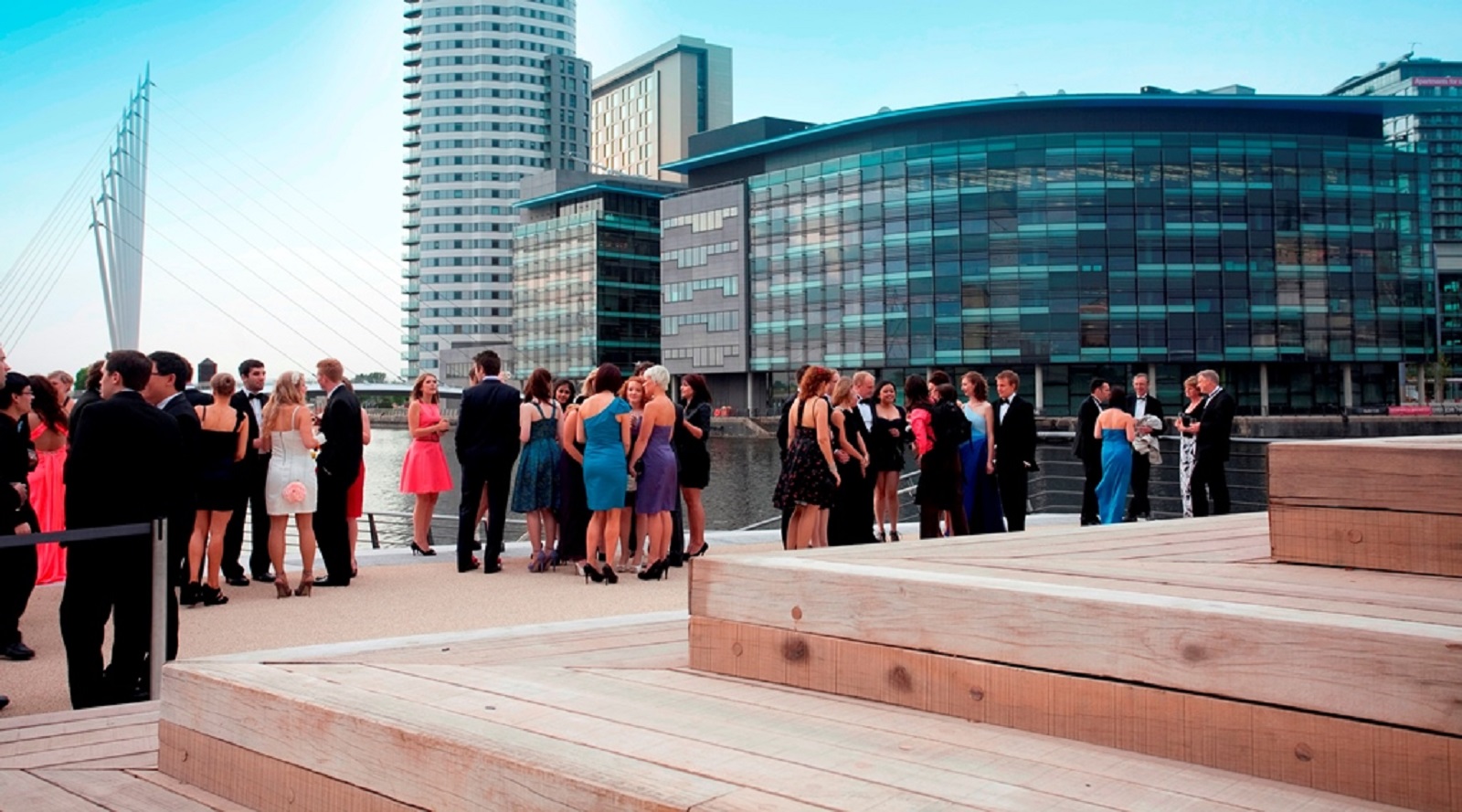 Elegant cocktail reception at Quayside, Imperial War Museum North, with modern architecture.