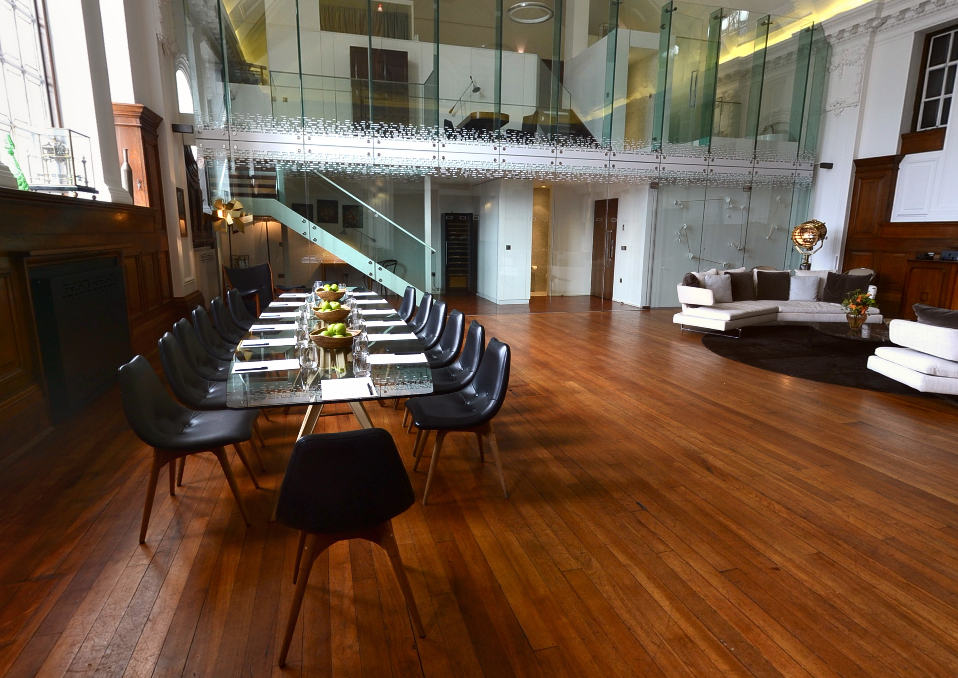 De Montfort Suite: modern meeting space with glass table, ideal for events and gatherings.