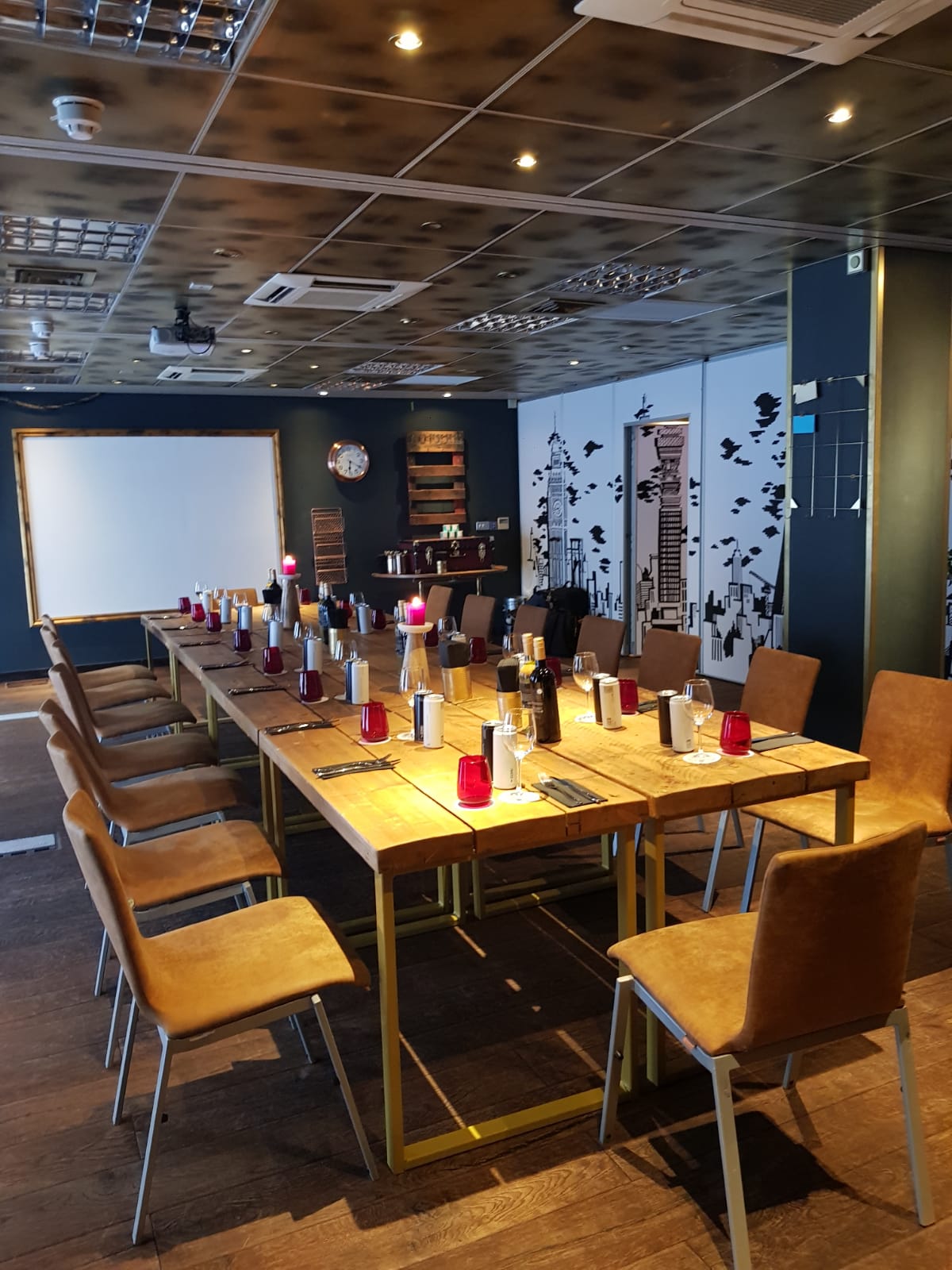 PlayHouse meeting space with wooden table, candles, ideal for events near Borough Market.