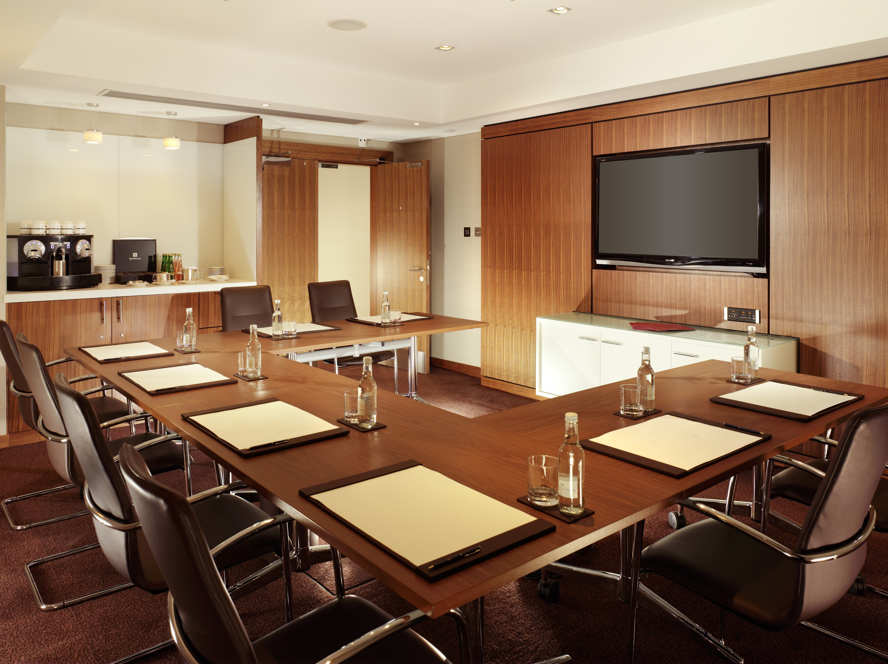Modern Executive Boardroom at Royal Garden Hotel, ideal for professional meetings and events.