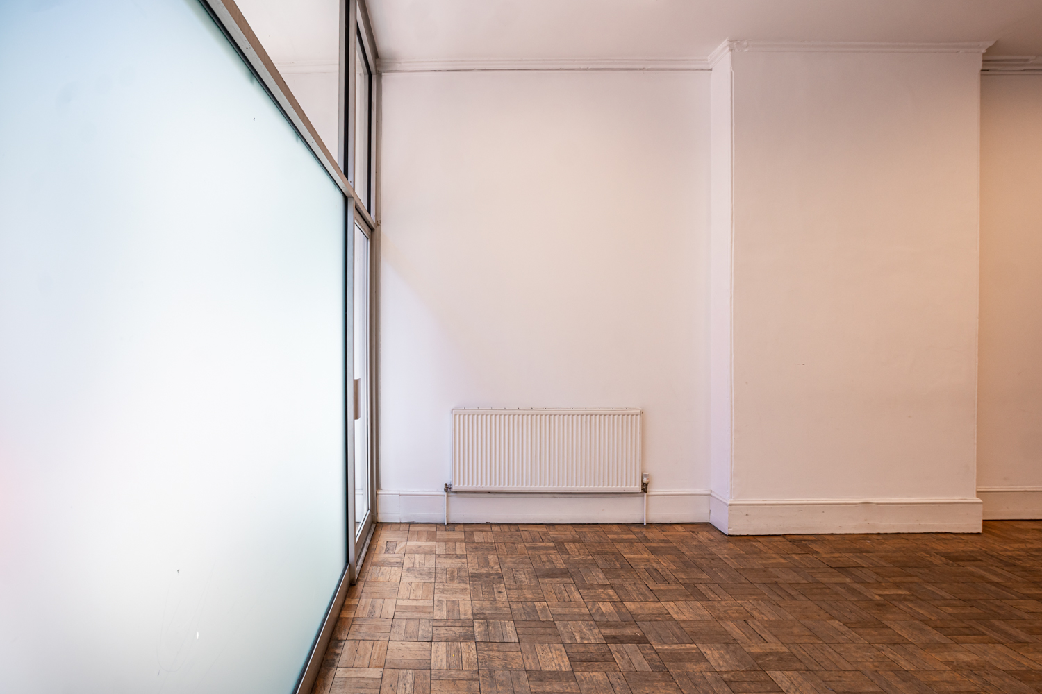Bertrand Russell Room at Conway Hall: minimalist space with large windows for workshops.