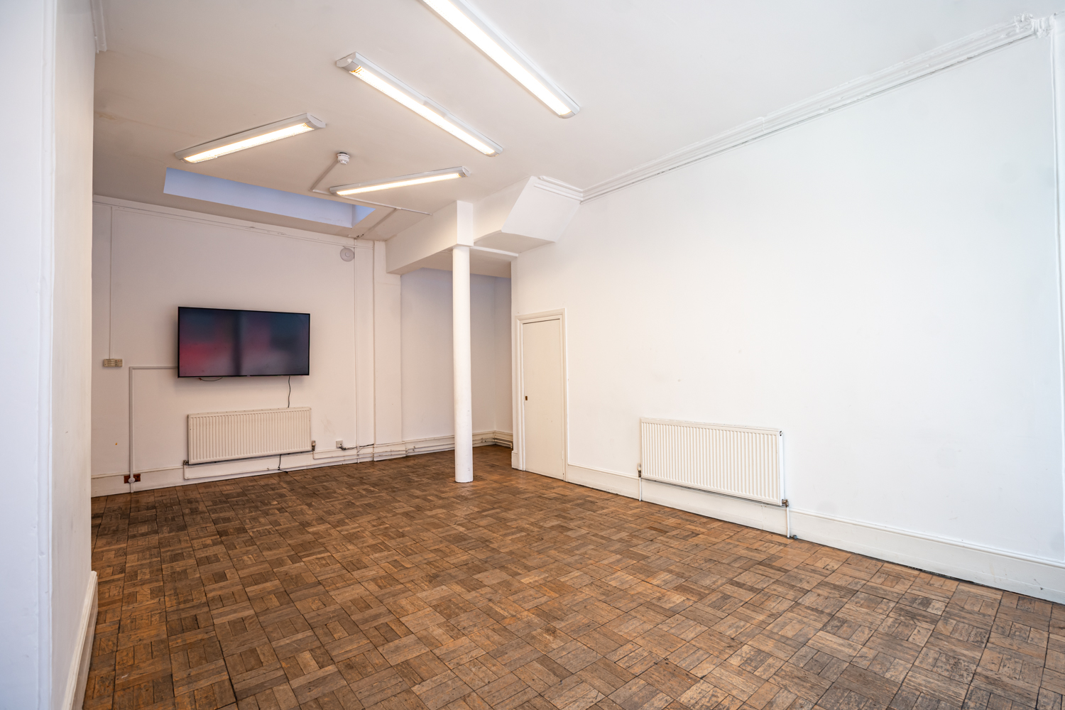 Bertrand Russell Room: minimalist event space with natural light for workshops and meetings.