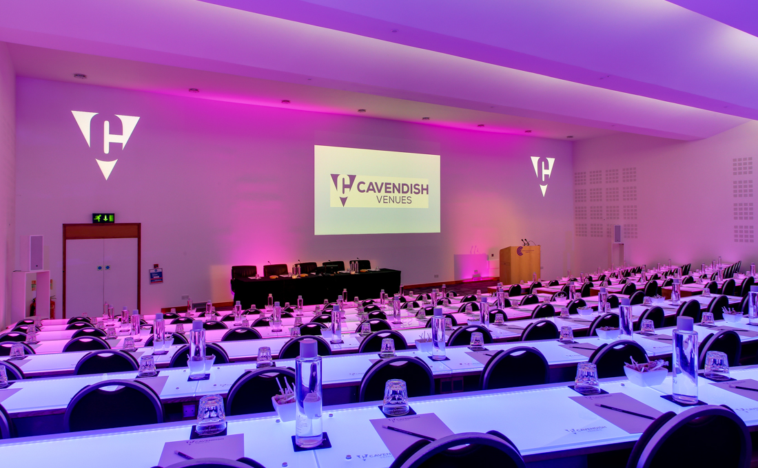 Cavendish Conference Centre auditorium with purple lighting for corporate events.