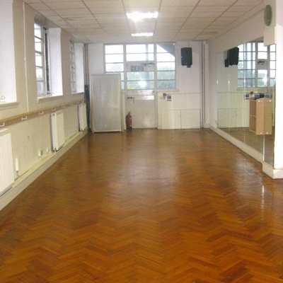 Dance studio in Husky Studios with polished wooden floor, ideal for workshops and classes.