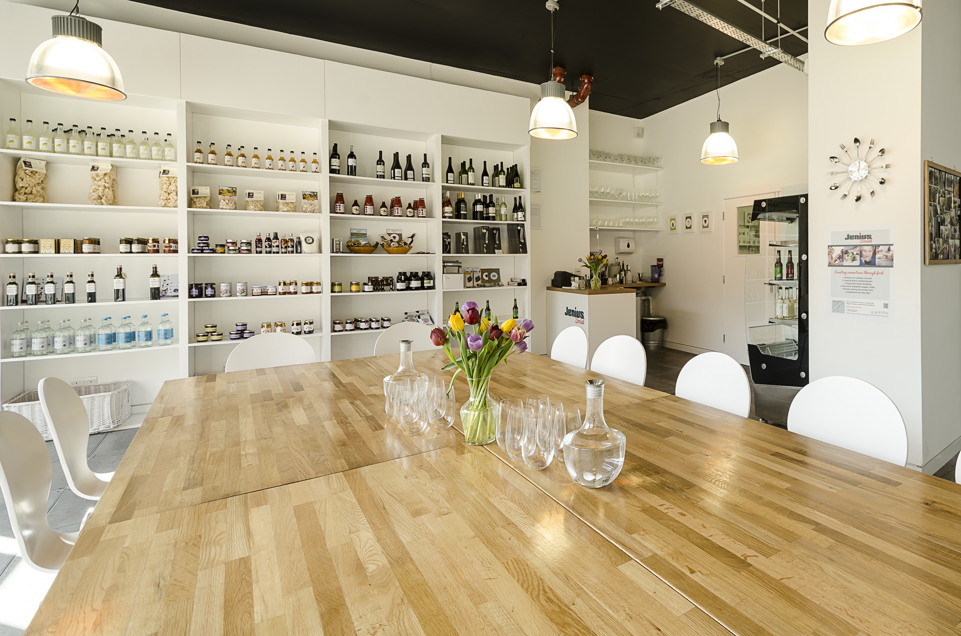 Modern meeting space with wooden table for workshops at Jenius Social Kitchen Hire.