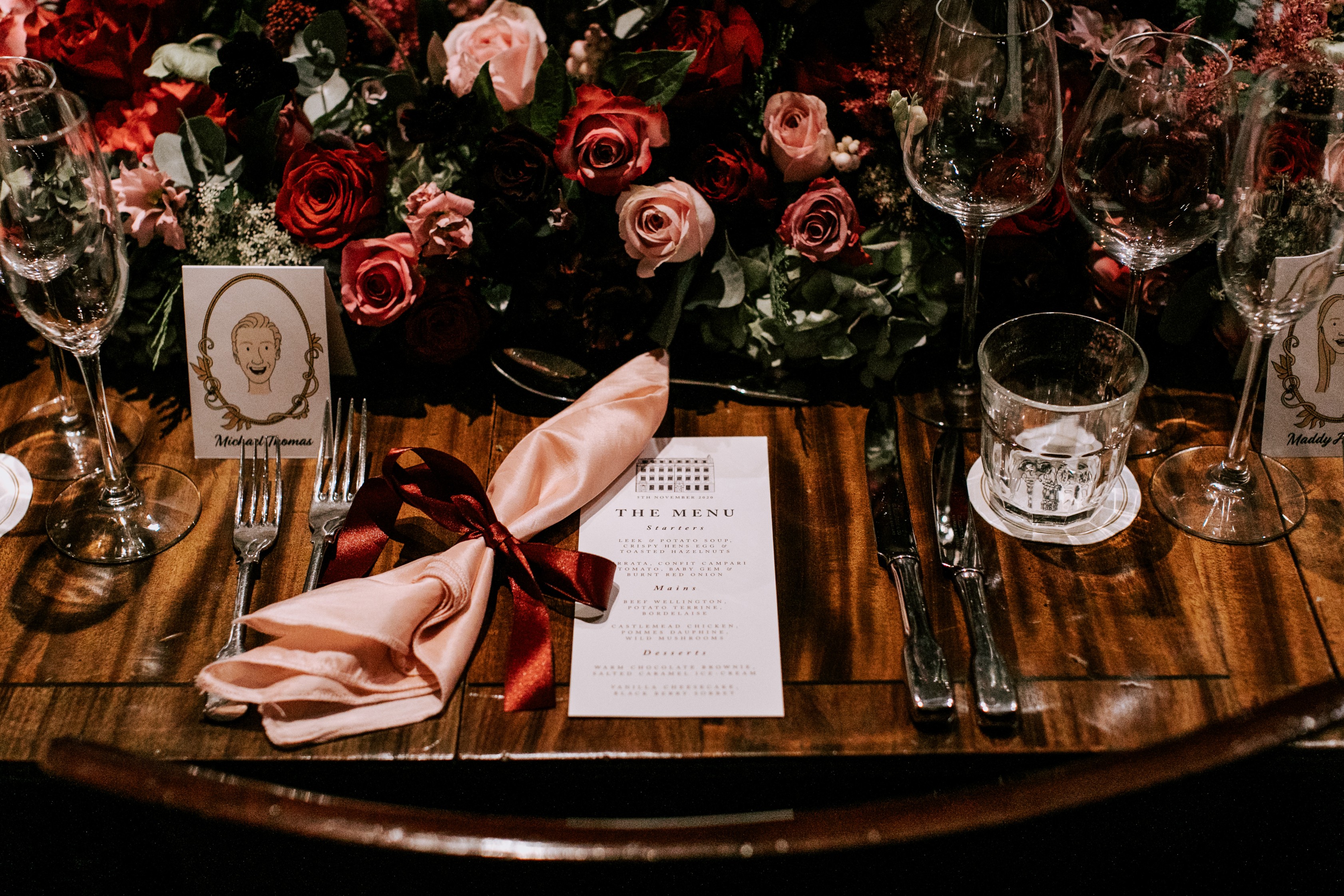 Elegant dining table with floral centerpiece for weddings and upscale events.