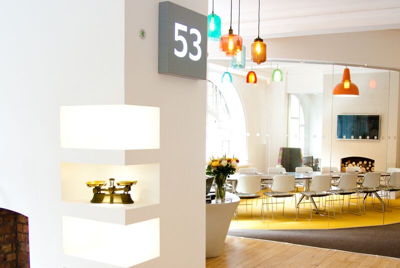 Modern meeting room with stylish lighting for creative workshops at 53 King Street.